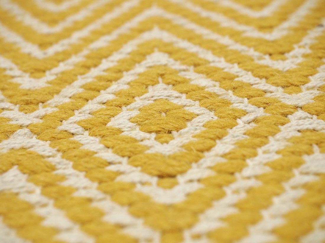 Mustard yellow and white woven runner with aztec chevron pattern