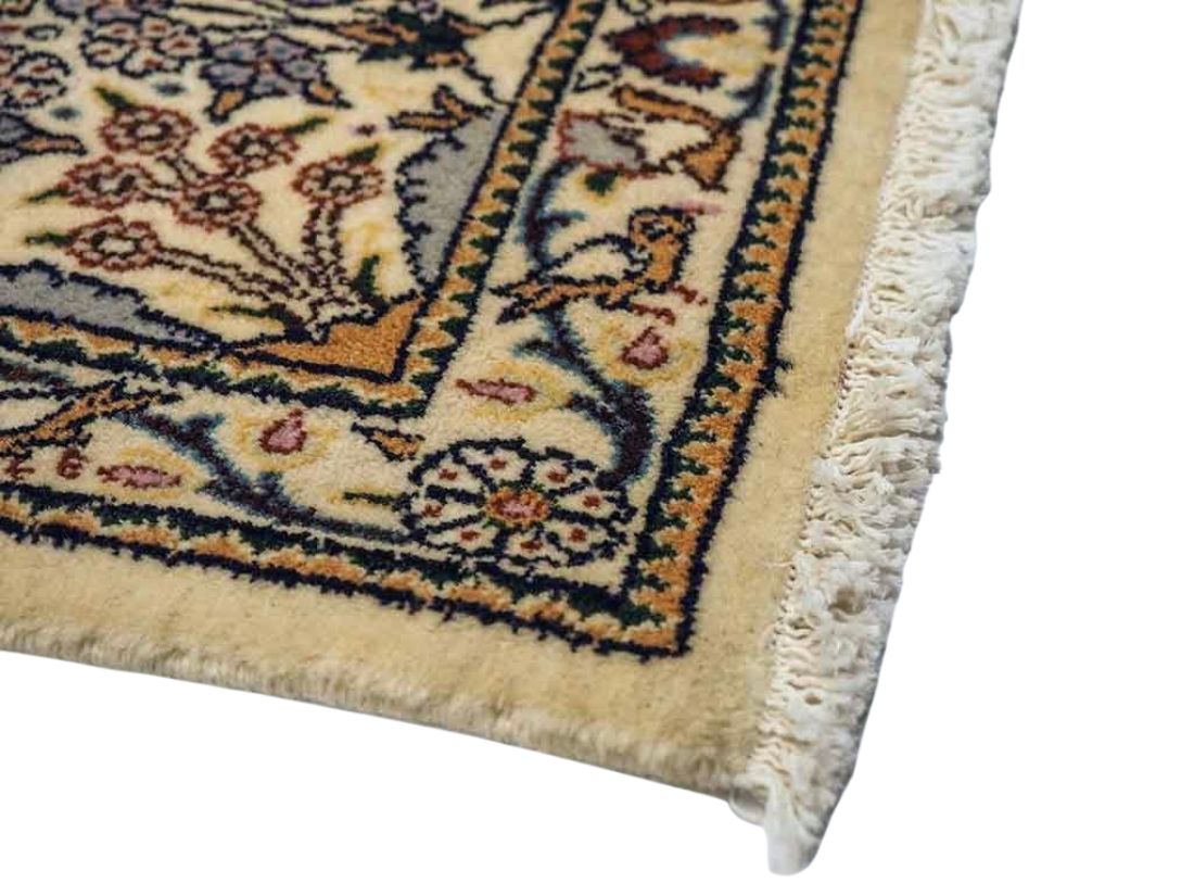 authentic persian rug with floral pattern in beige