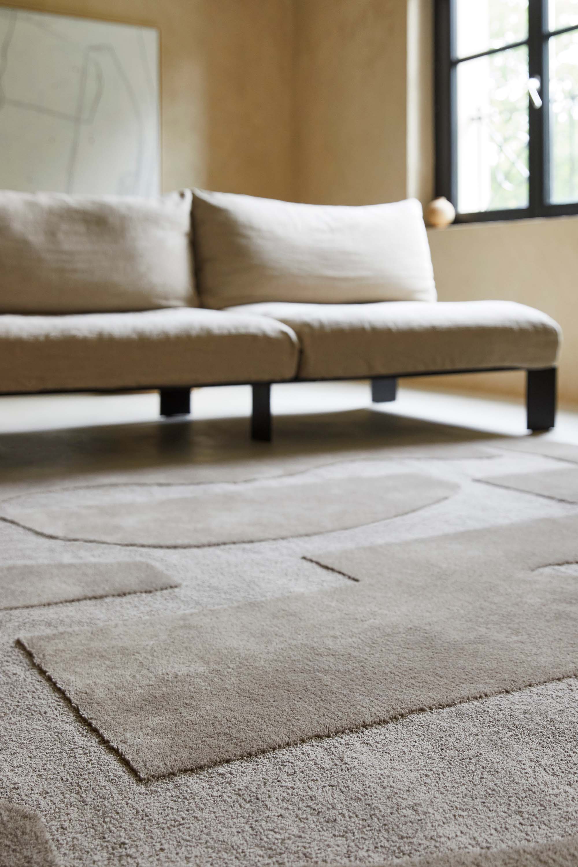 beige wool rug with geometric textured design