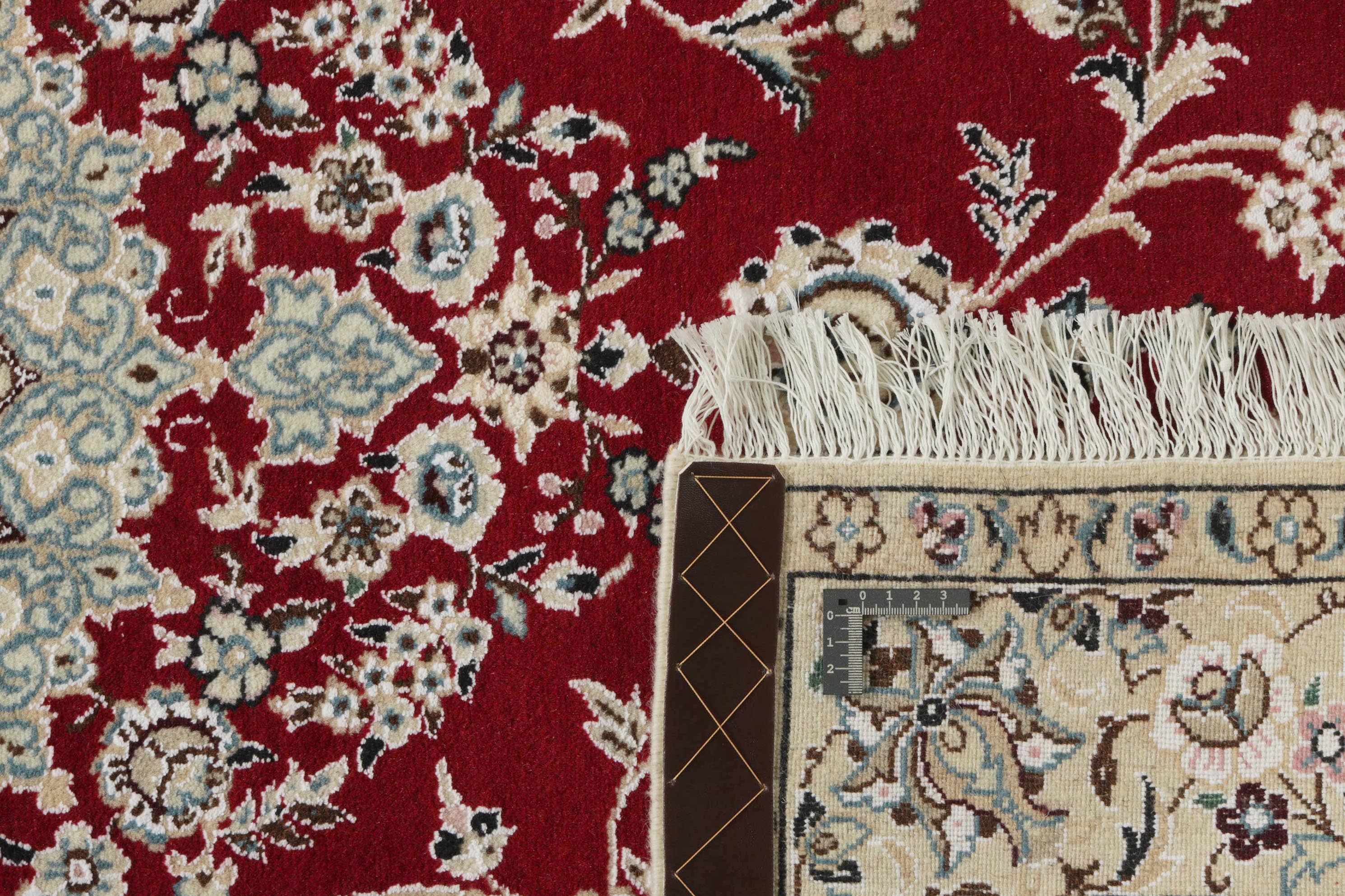 Authentic oriental rug with traditional floral design in red