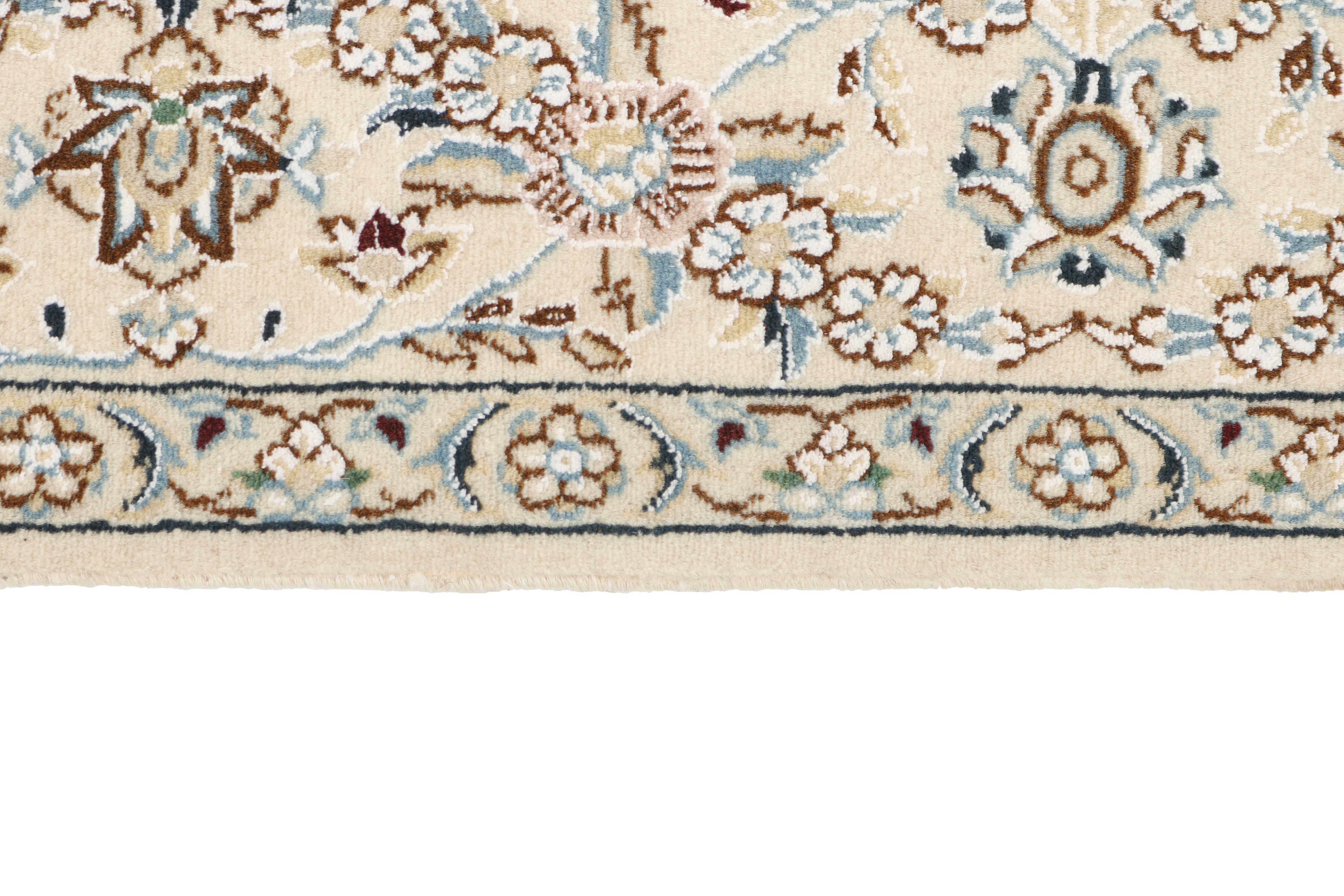 Authentic oriental rug with traditional floral design in ivory and red