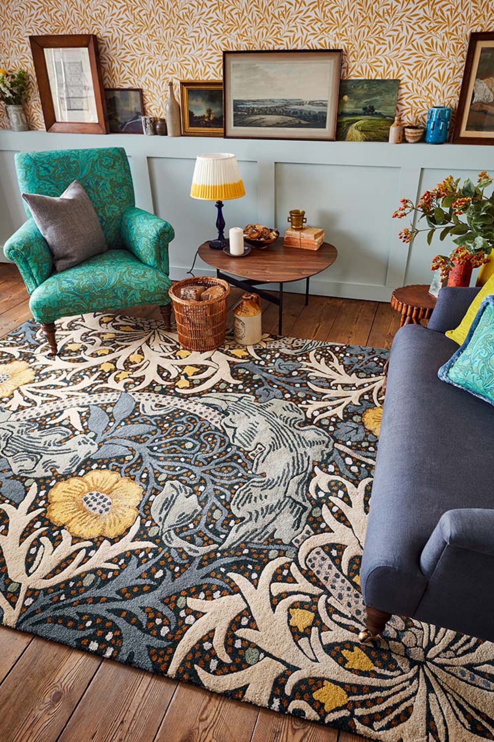 blue, mustard and cream wool rug with nature inspired print