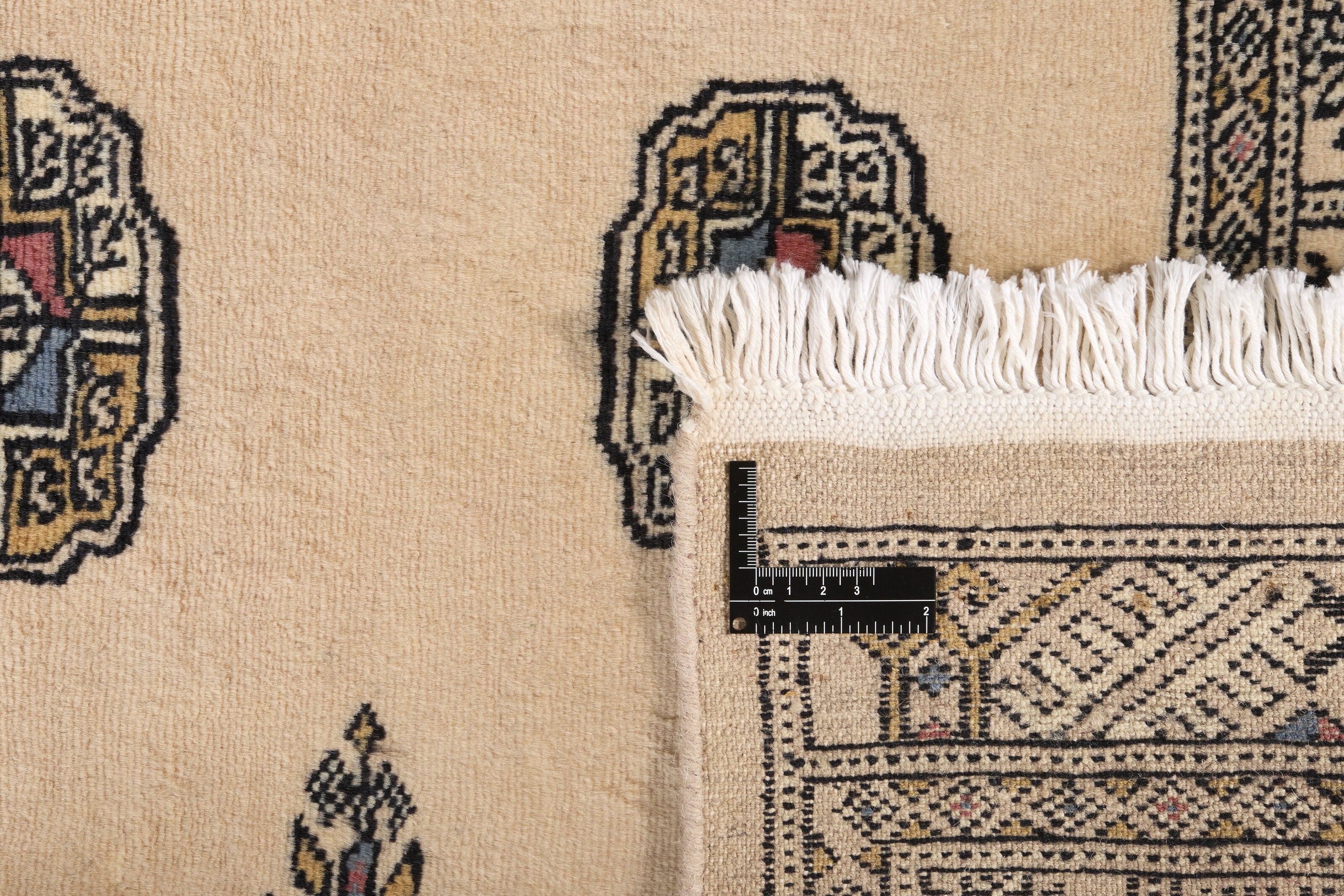 Beige Oriental runner with traditional bordered pattern