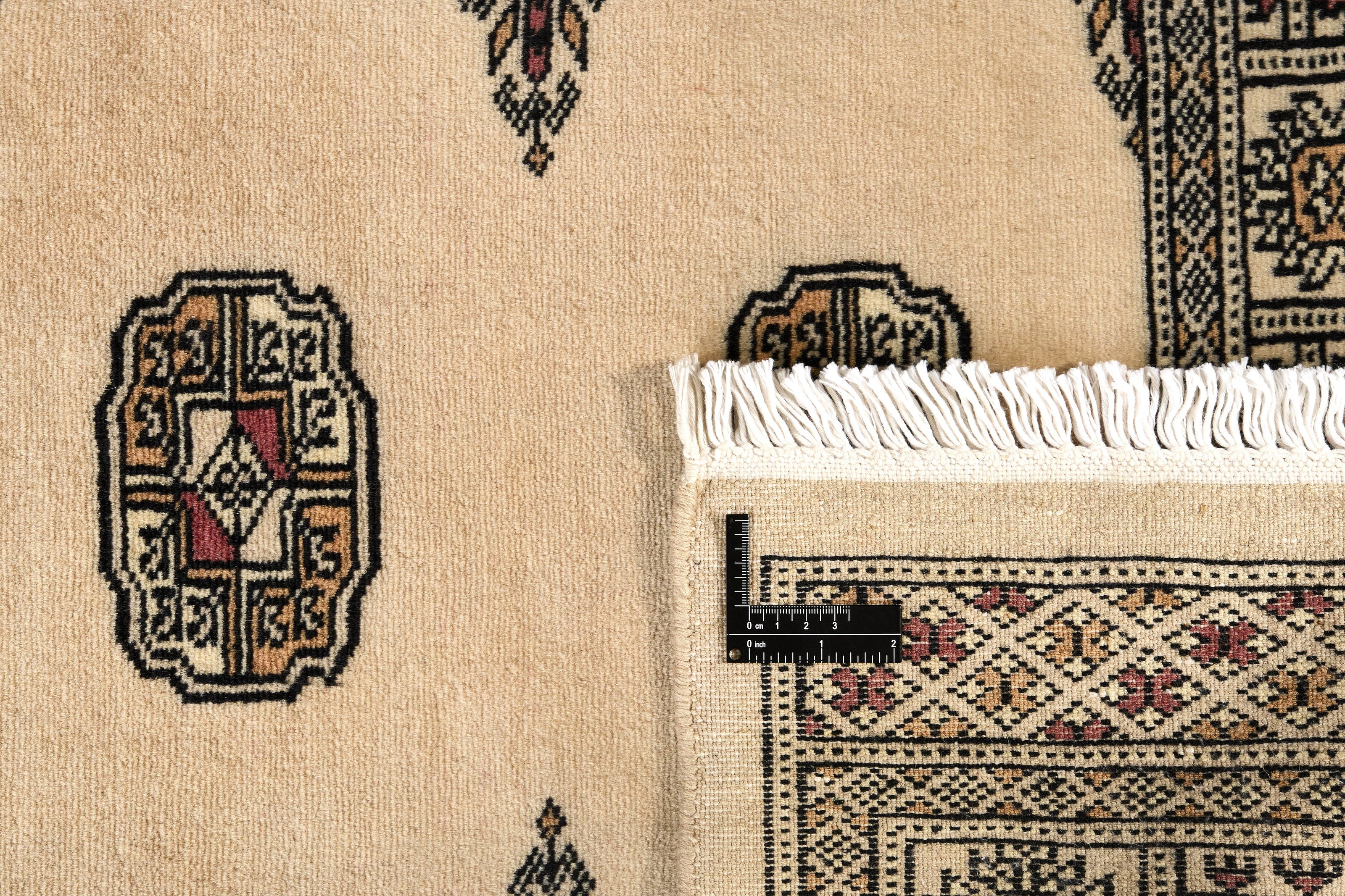 Beige Oriental runner with traditional bordered pattern