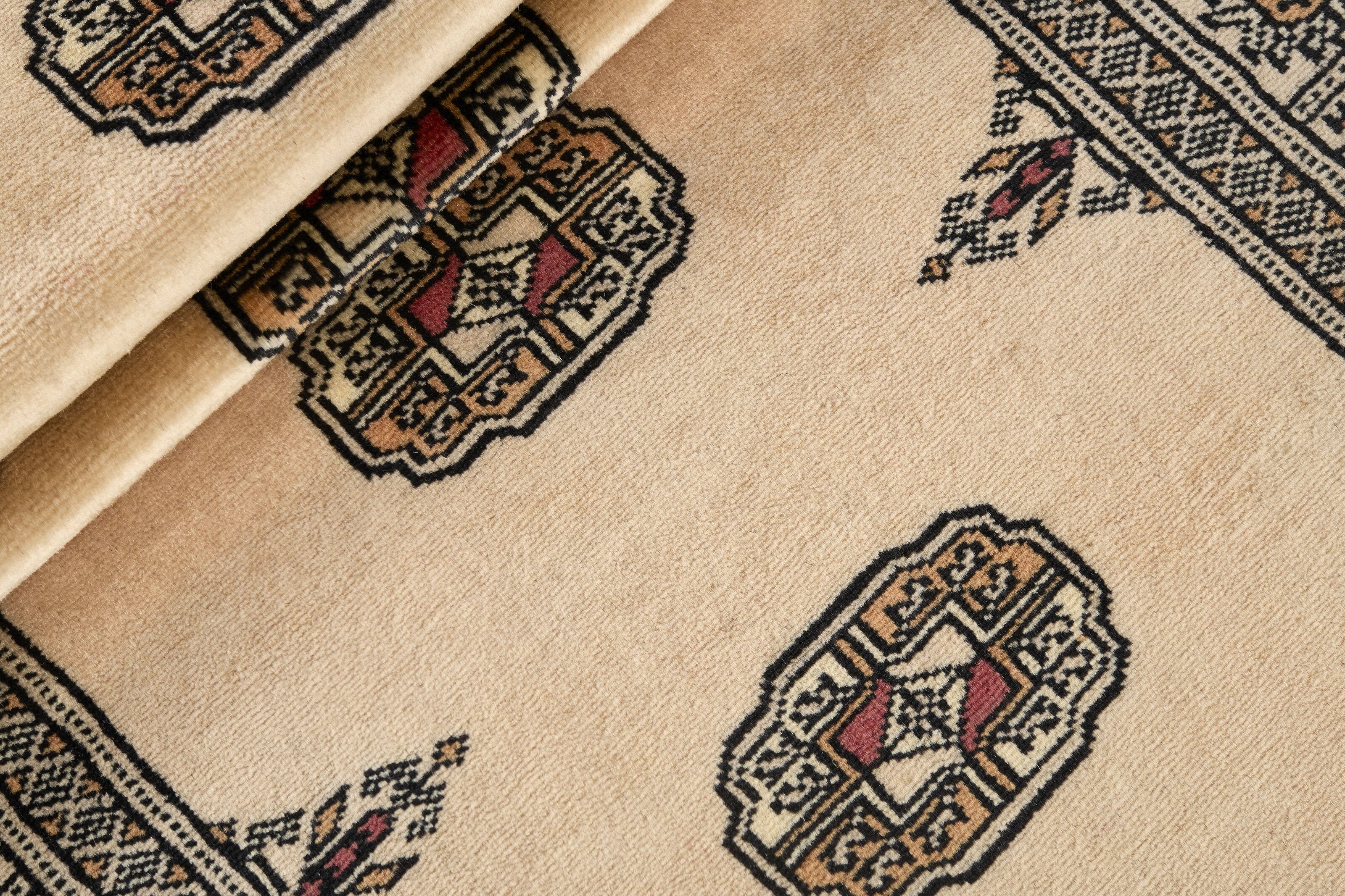 Beige Oriental runner with traditional bordered pattern