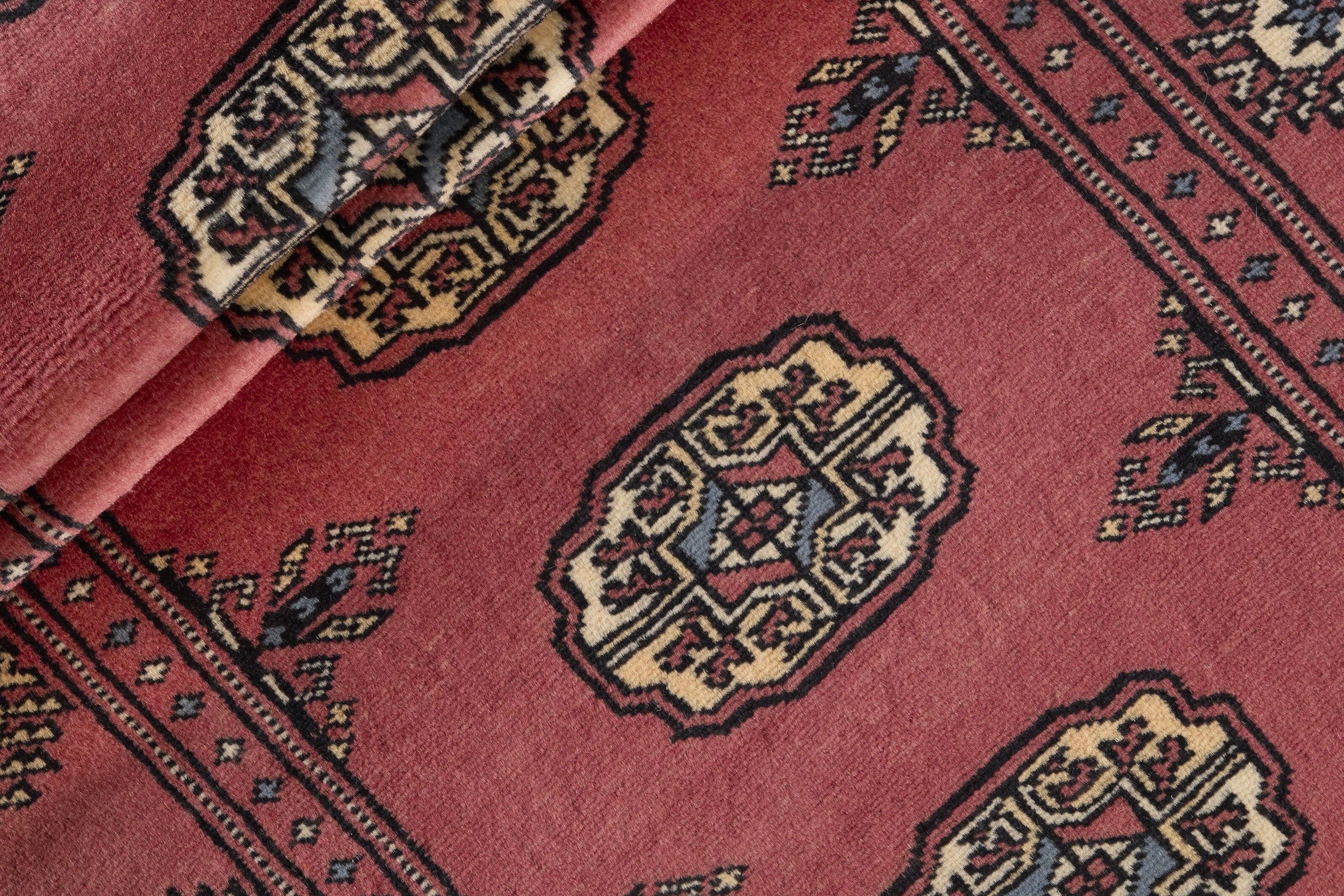 Red Oriental runner with traditional bordered pattern