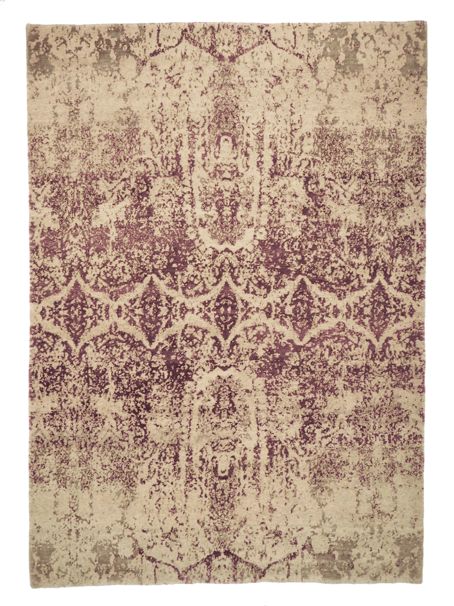 pink and beige rug with an abstract damask pattern