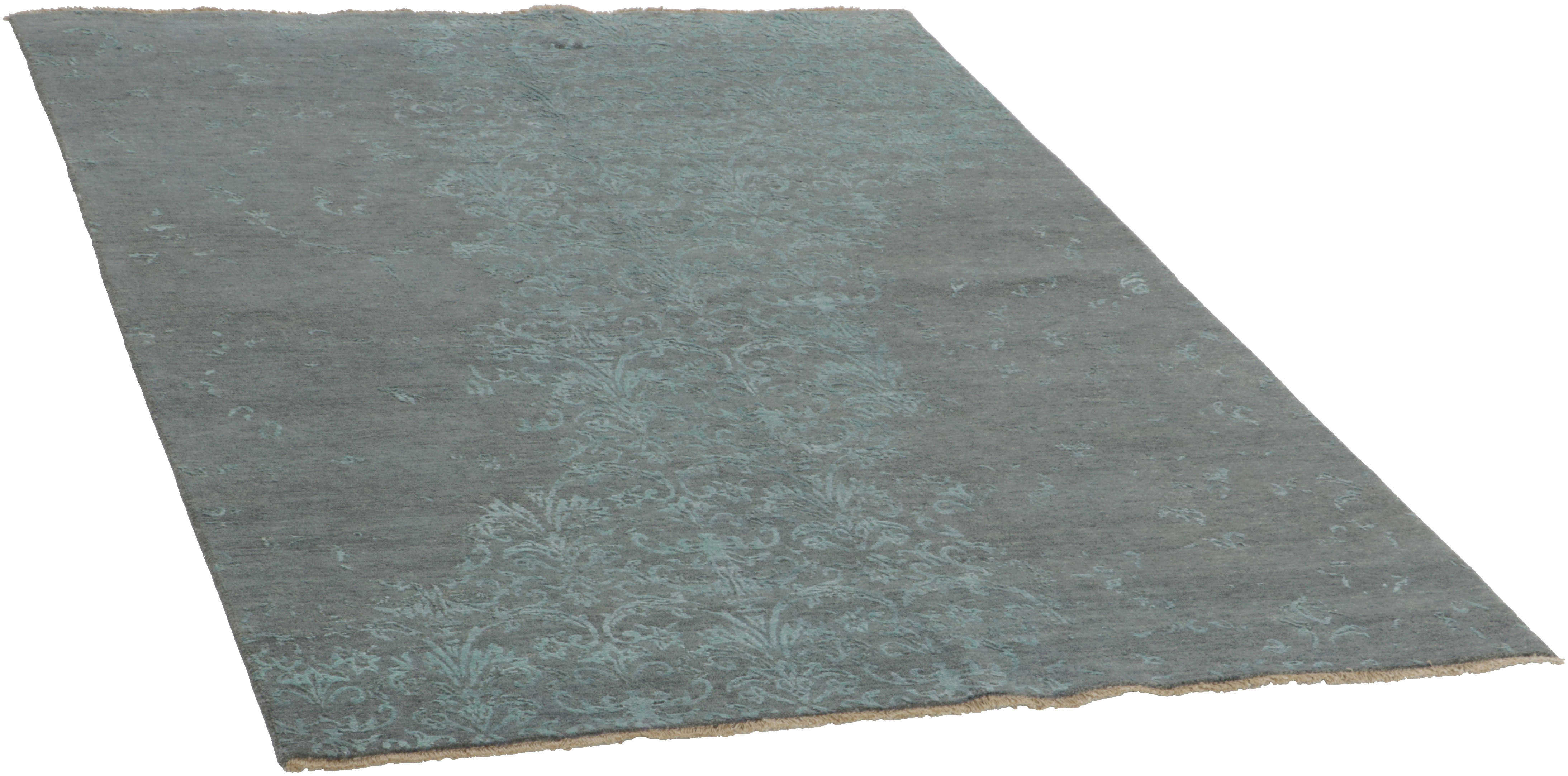 Authentic oriental rug with a damask pattern in blue