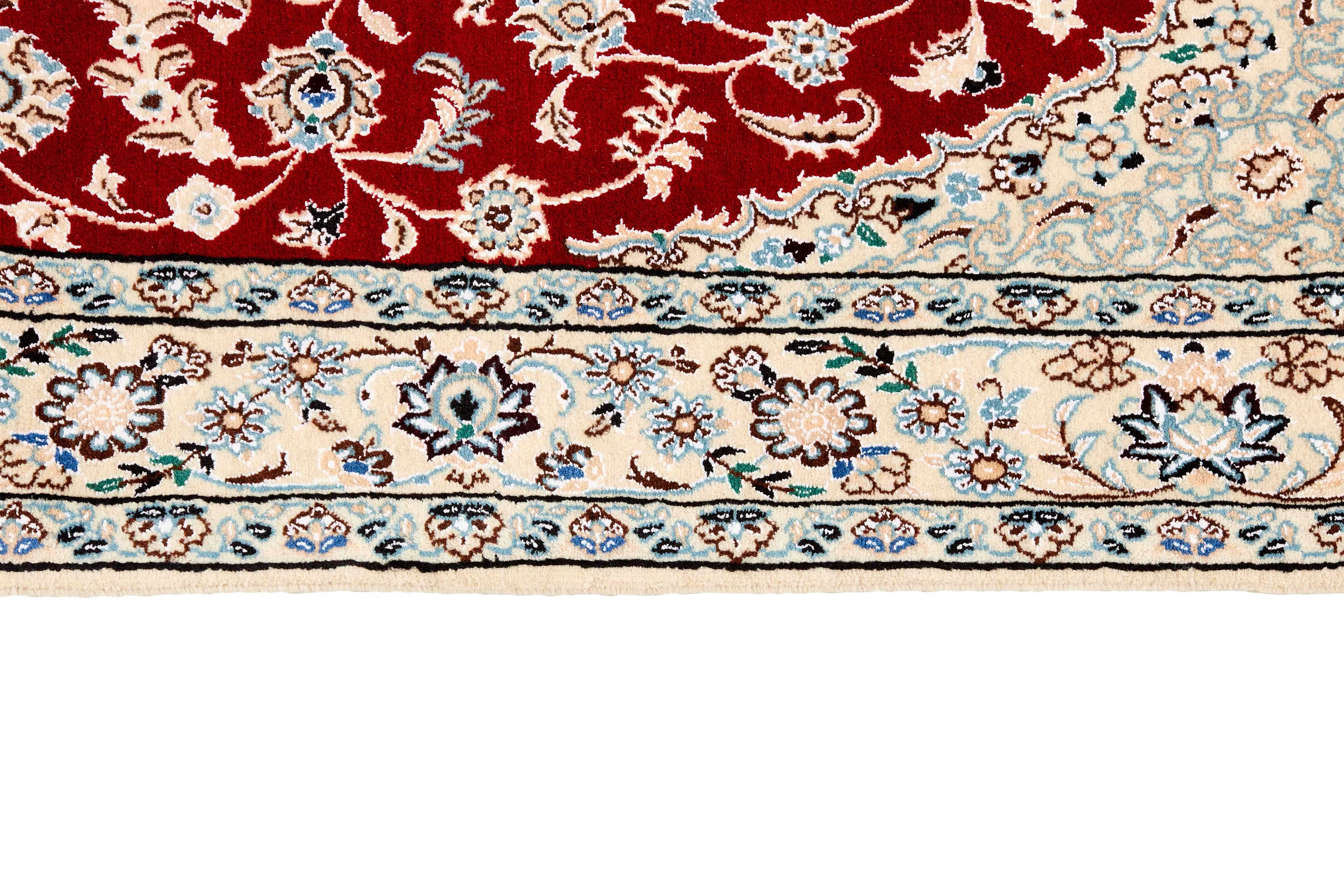 Authentic oriental rug with traditional floral design in ivory and beige