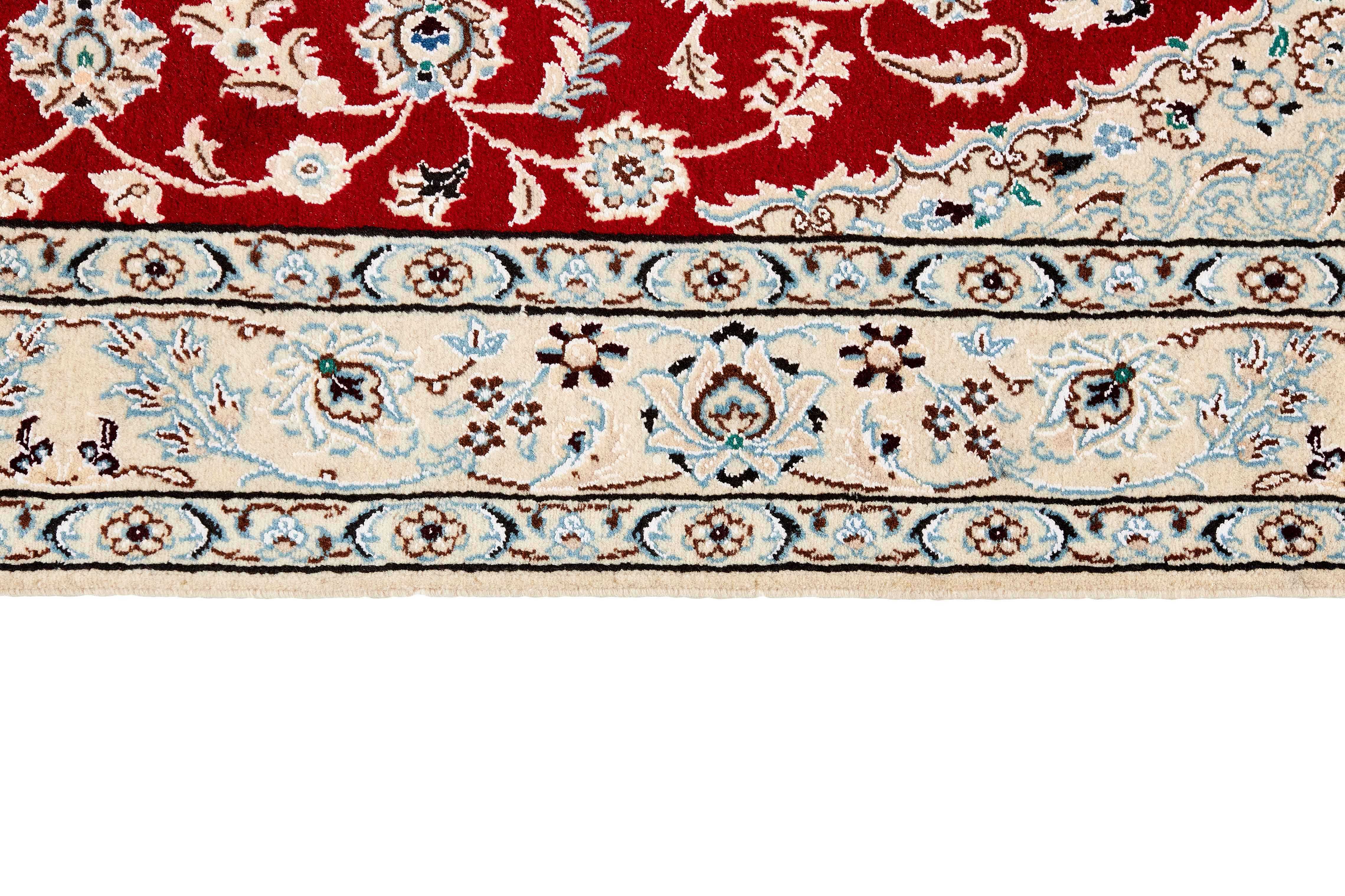 Authentic oriental rug with traditional floral design in ivory and beige