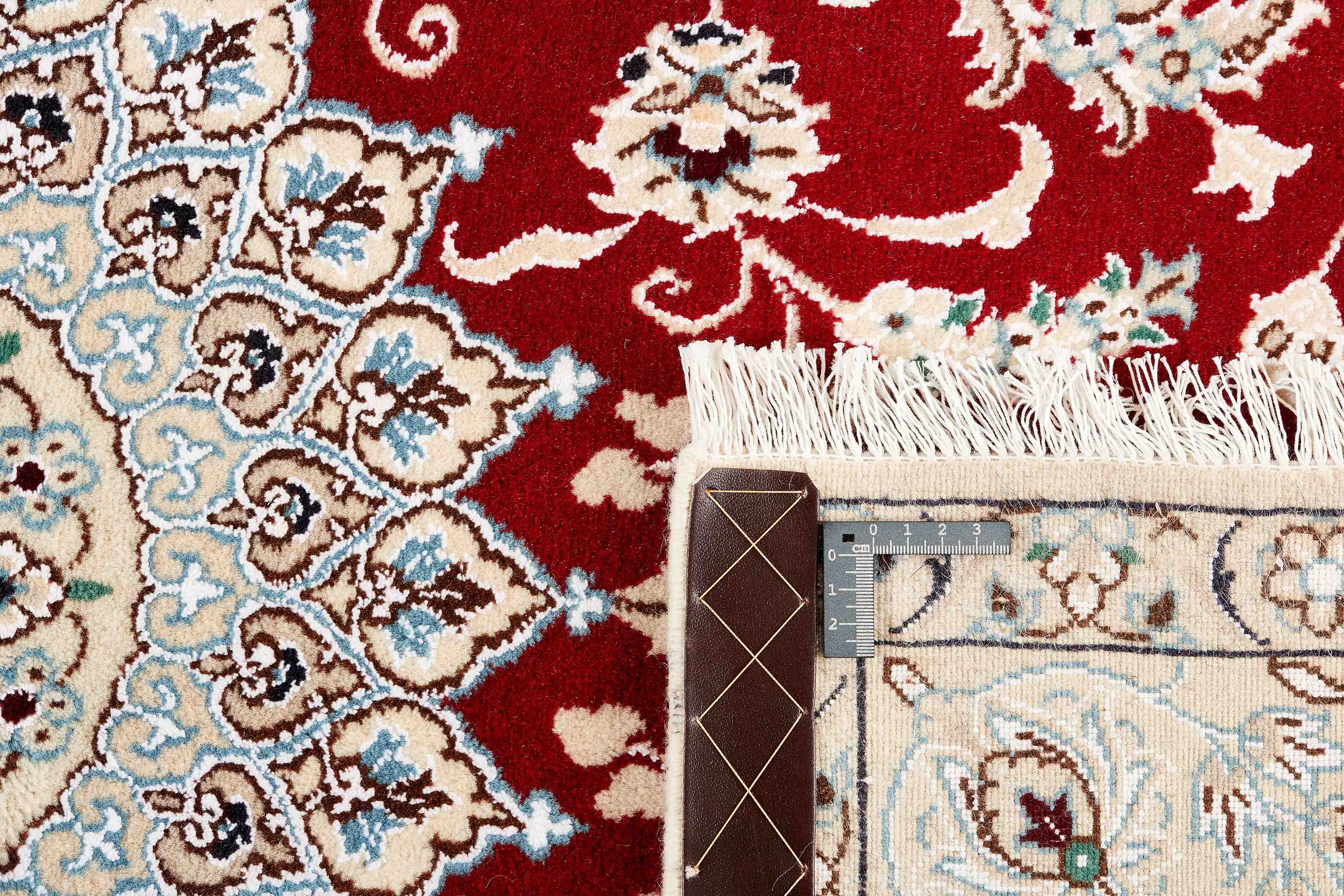 Authentic oriental rug with traditional floral design in red