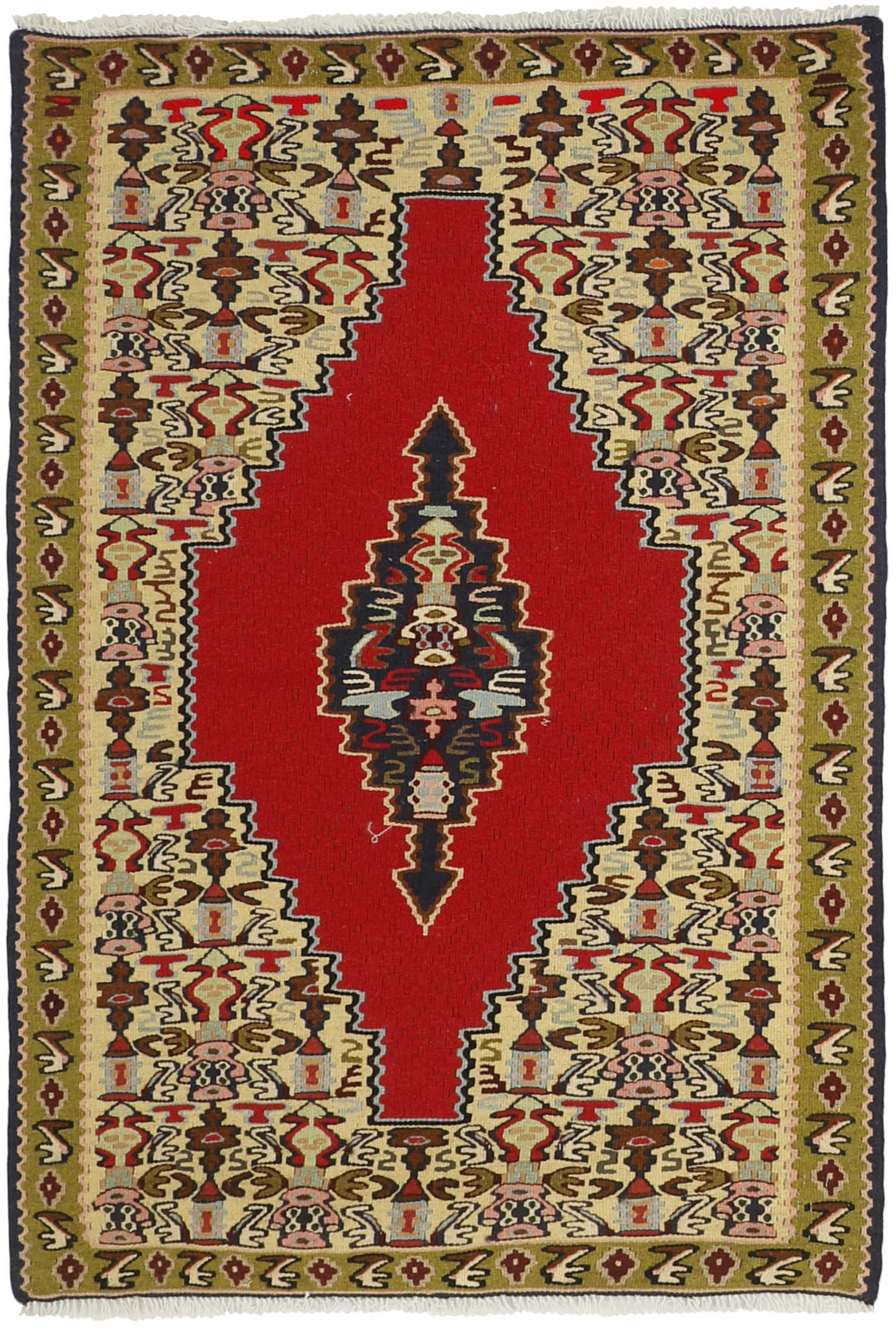 Rectangular natural beige rug with terracotta red, grey and black aztec design and black tassel border