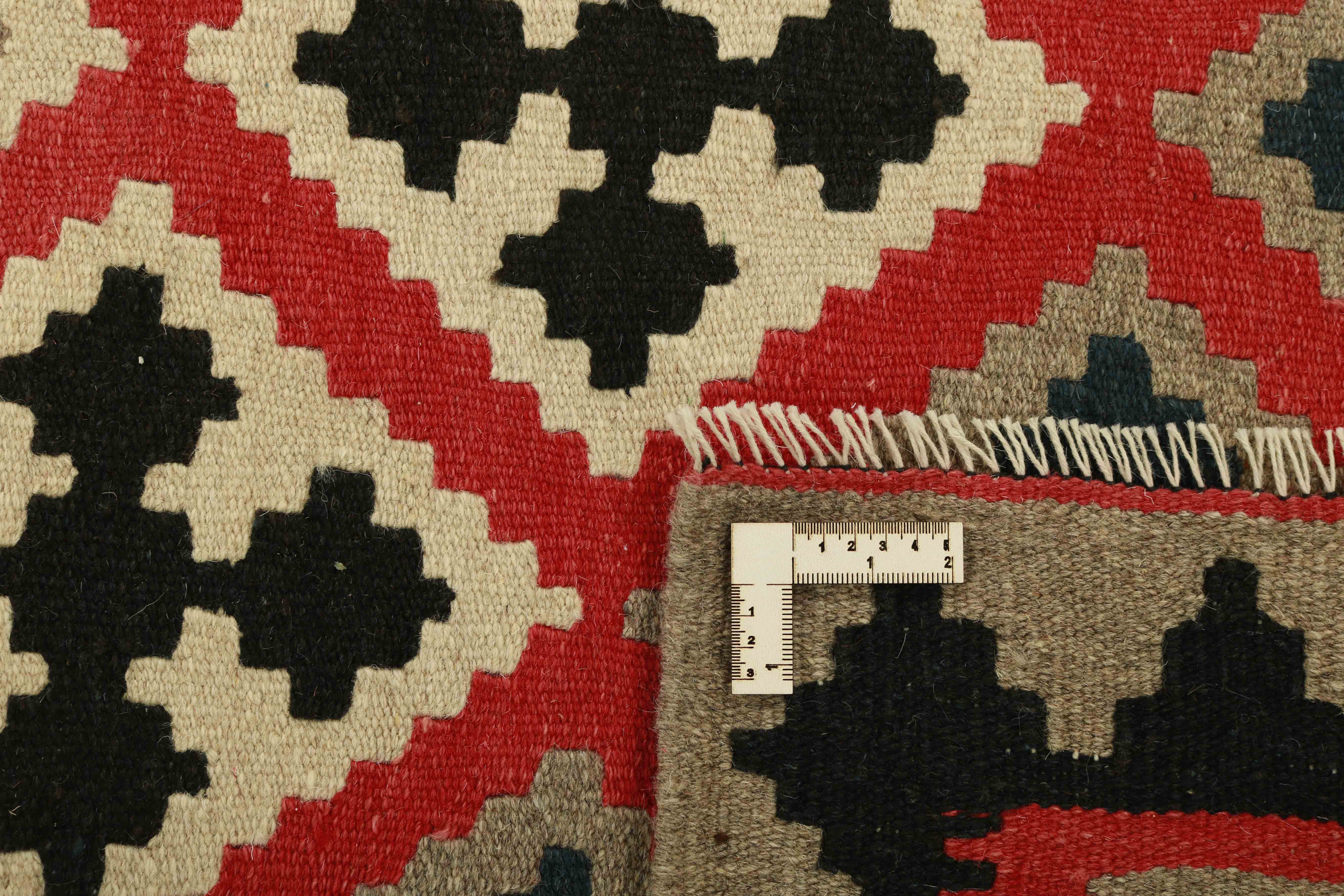 Authentic persian kelim flatweave rug with traditional geometric design in multicolour