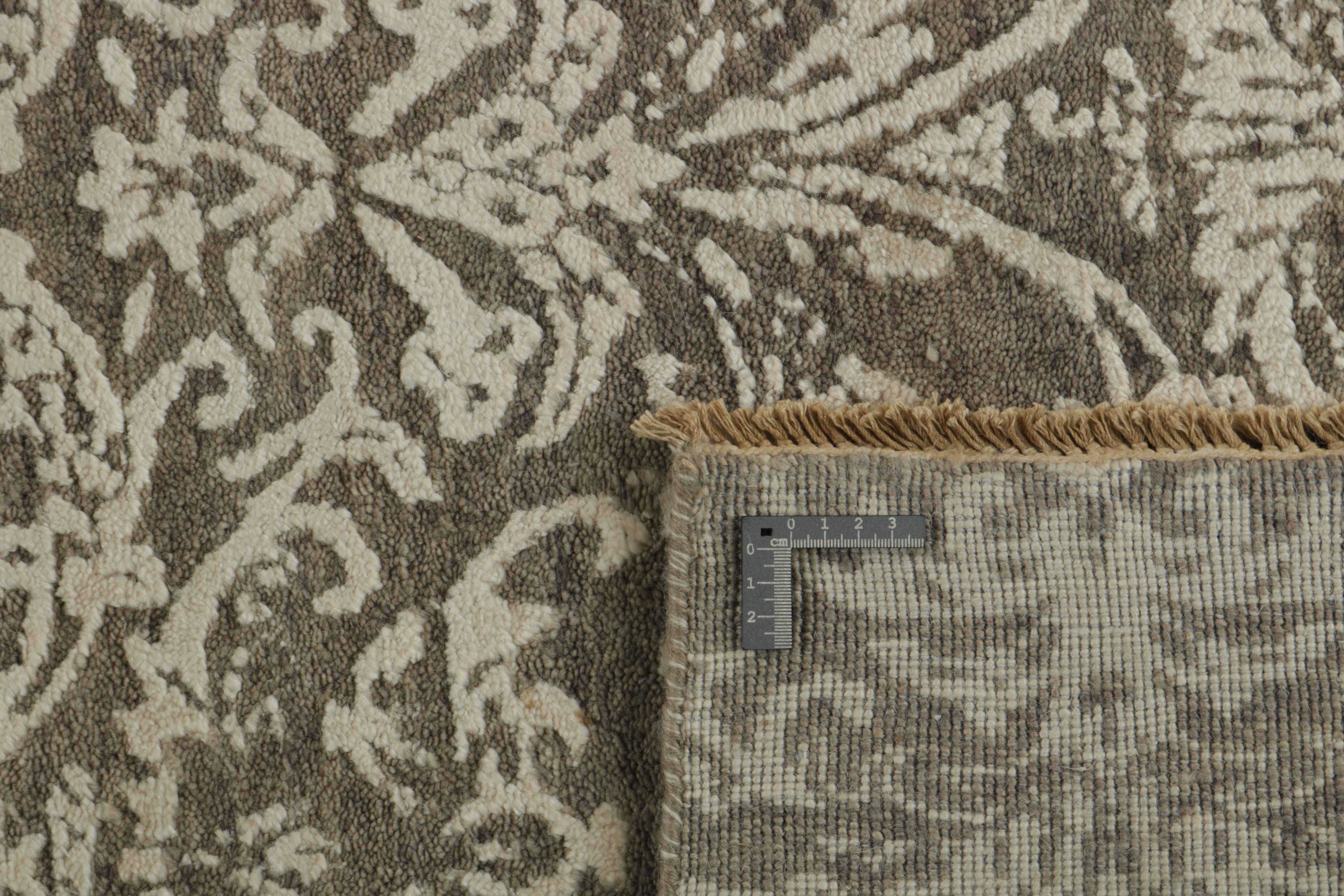 Authentic oriental rug with a damask pattern in beige