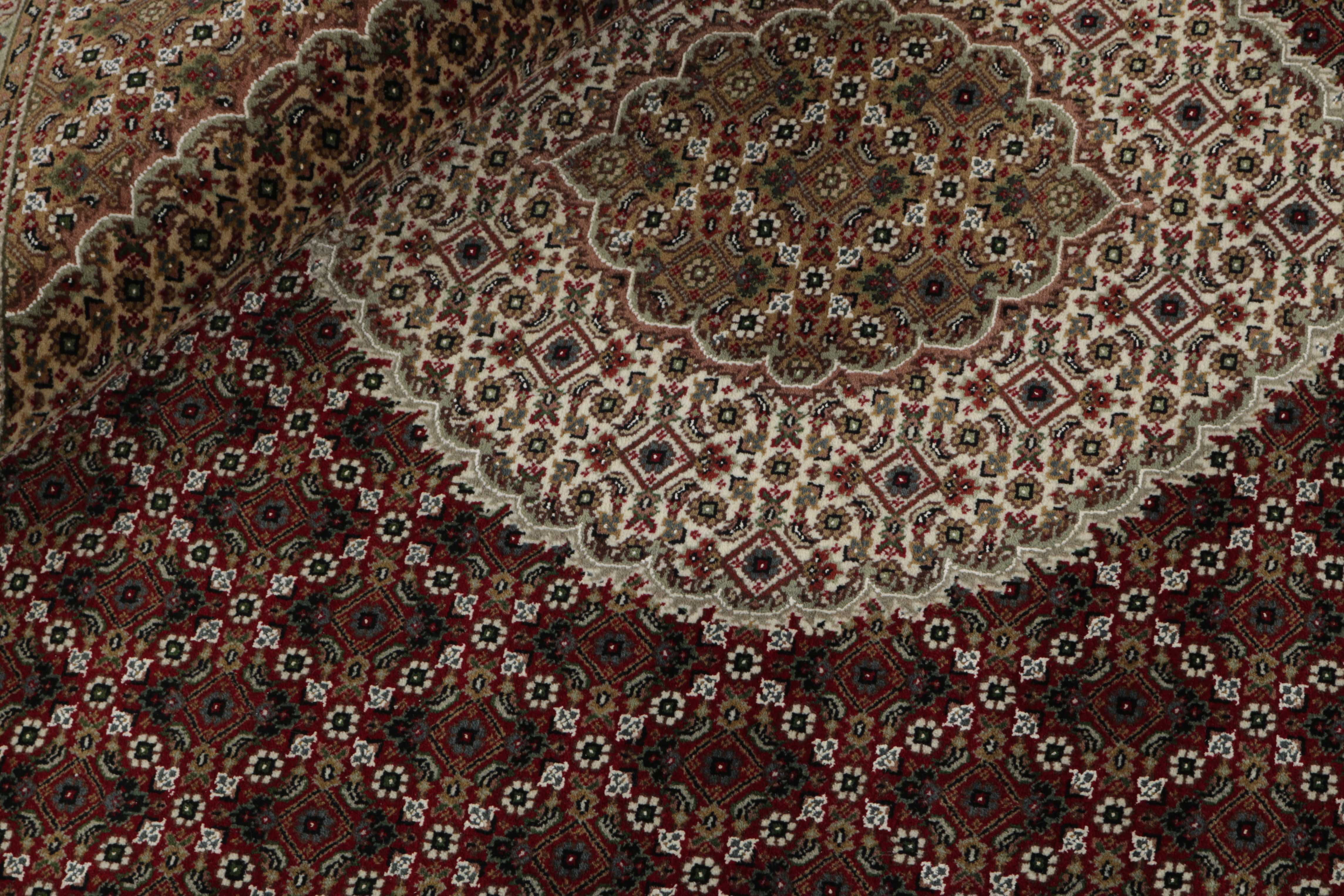 Authentic Oriental rug with traditional geometric and floral design in grey