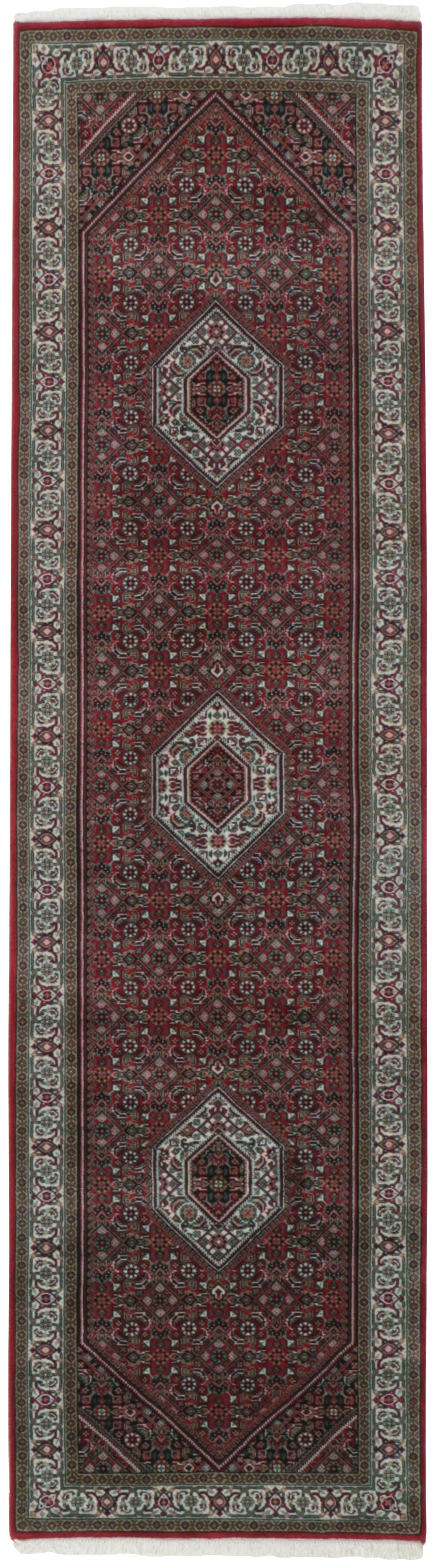 Authentic oriental rug with central medallion and traditional motifs in red, cream and brown