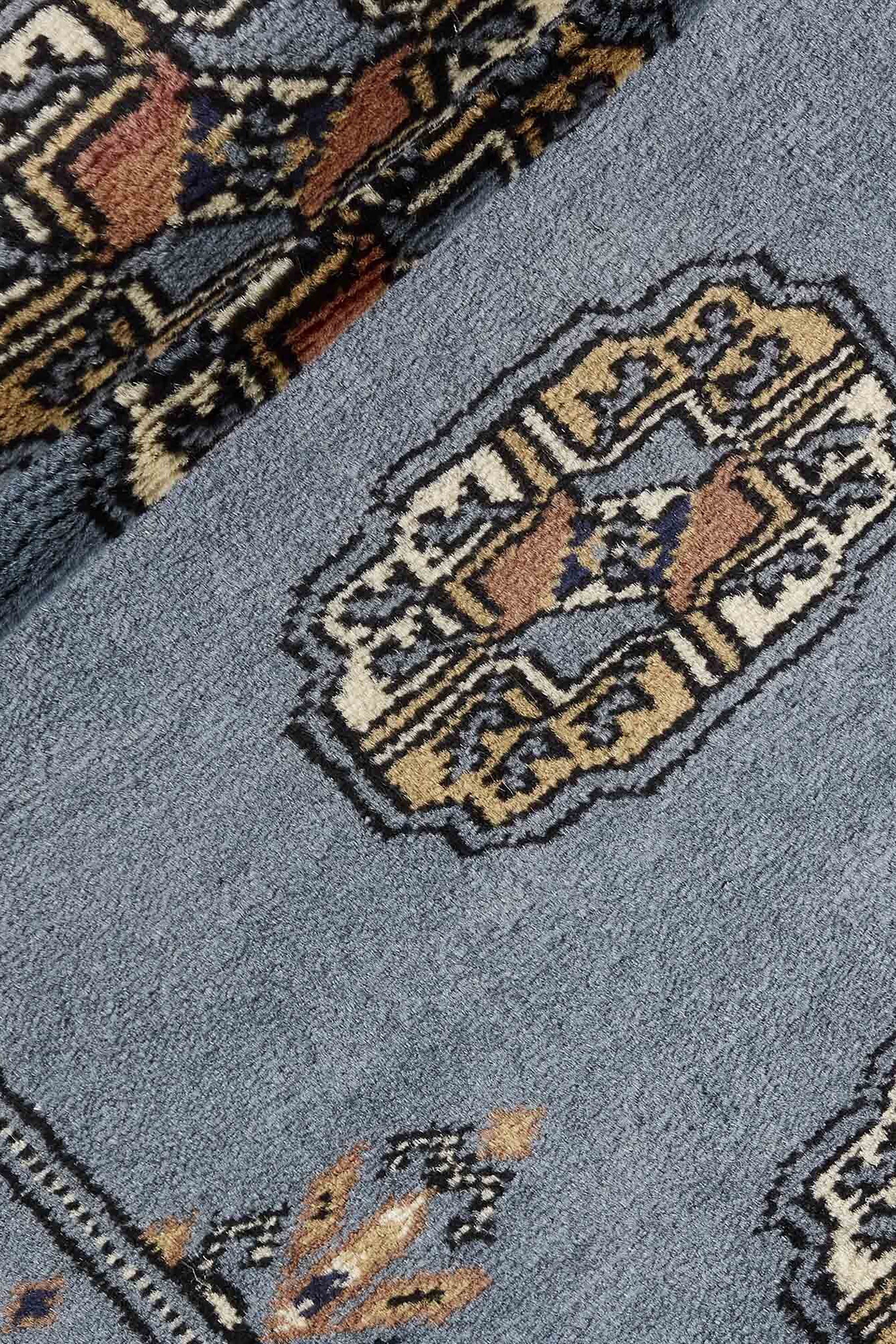 Blue Oriental runner with traditional bordered pattern