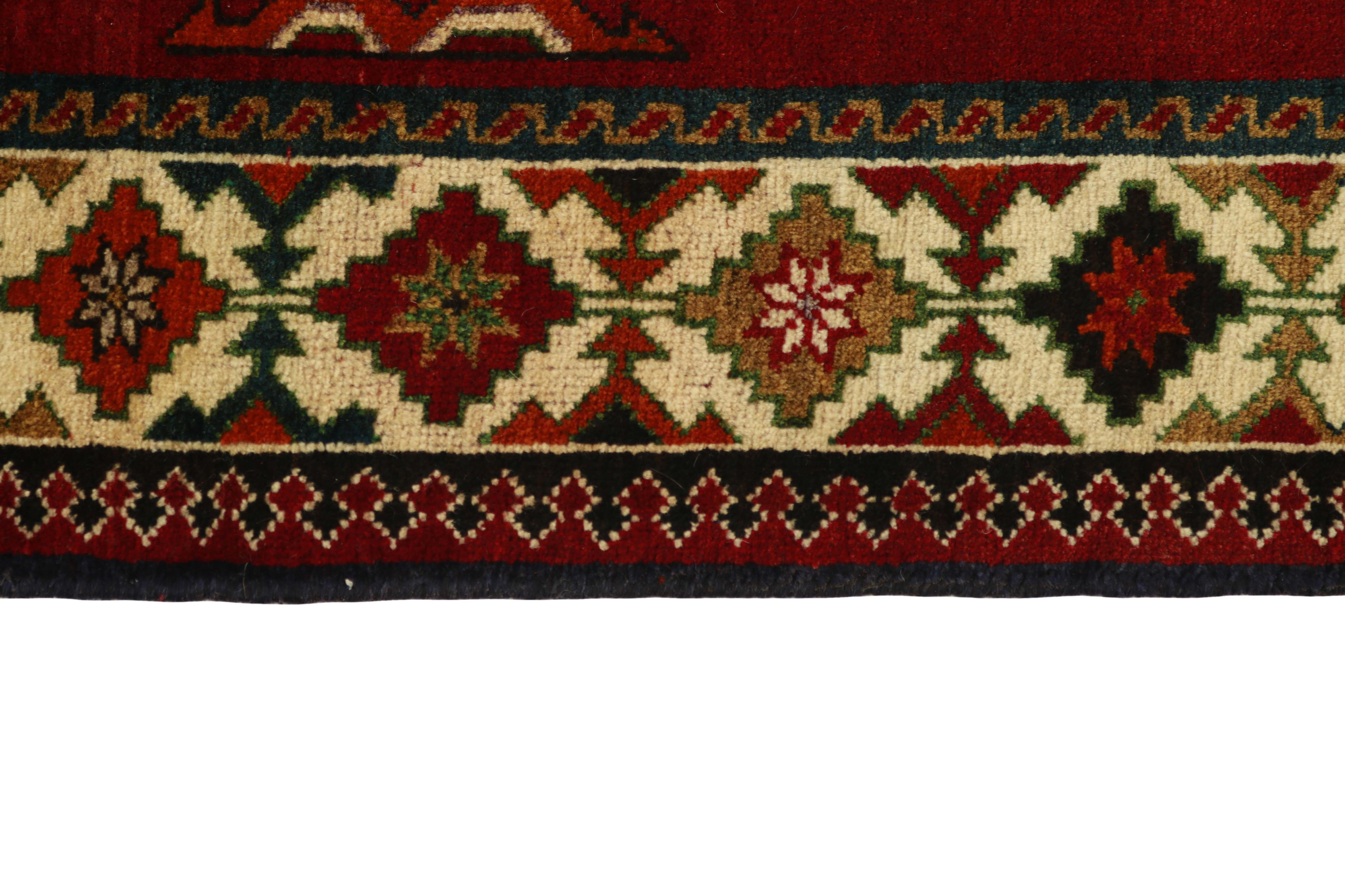 red and black persian rug with traditional figural design