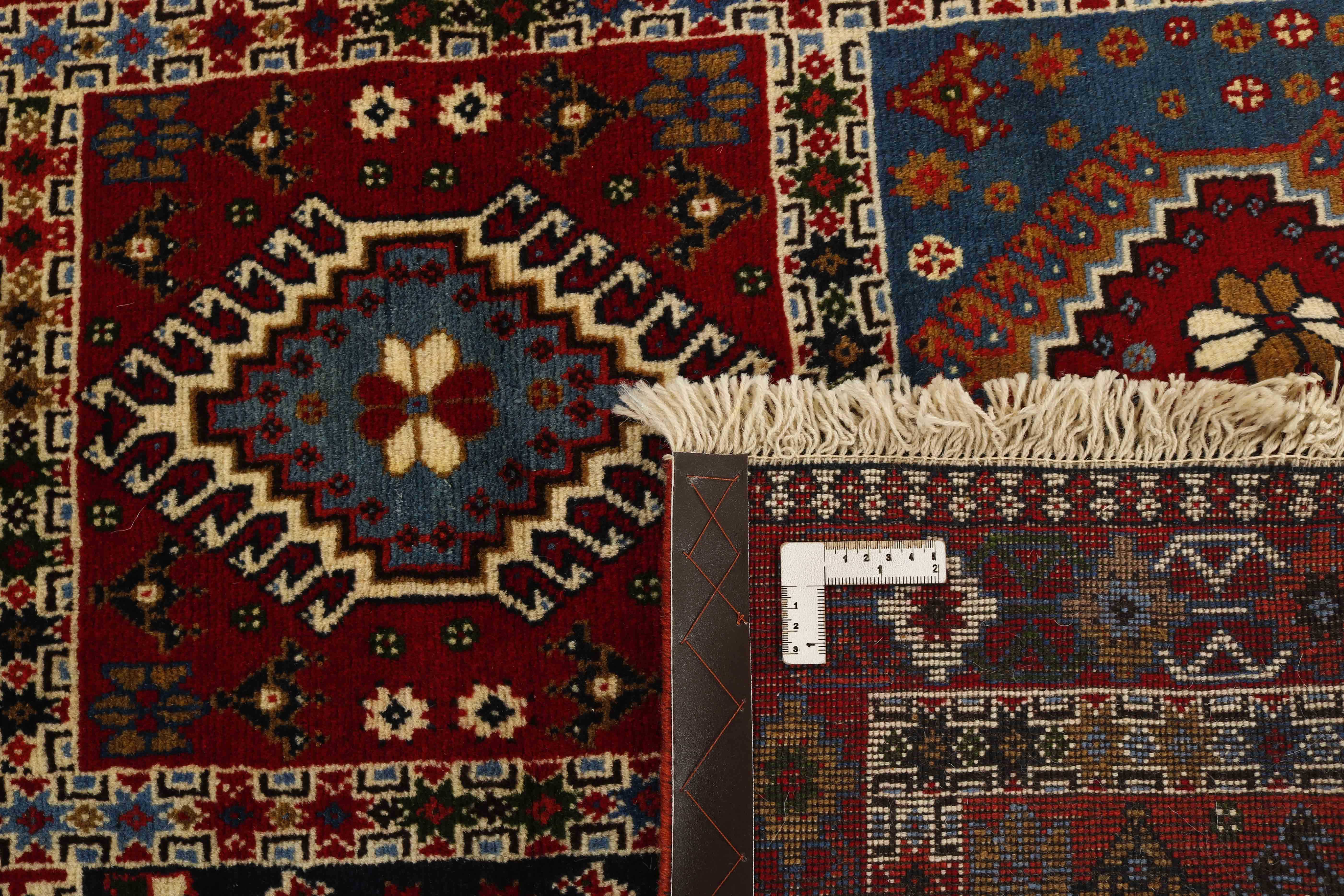 red authentic persian rug with a traditional design