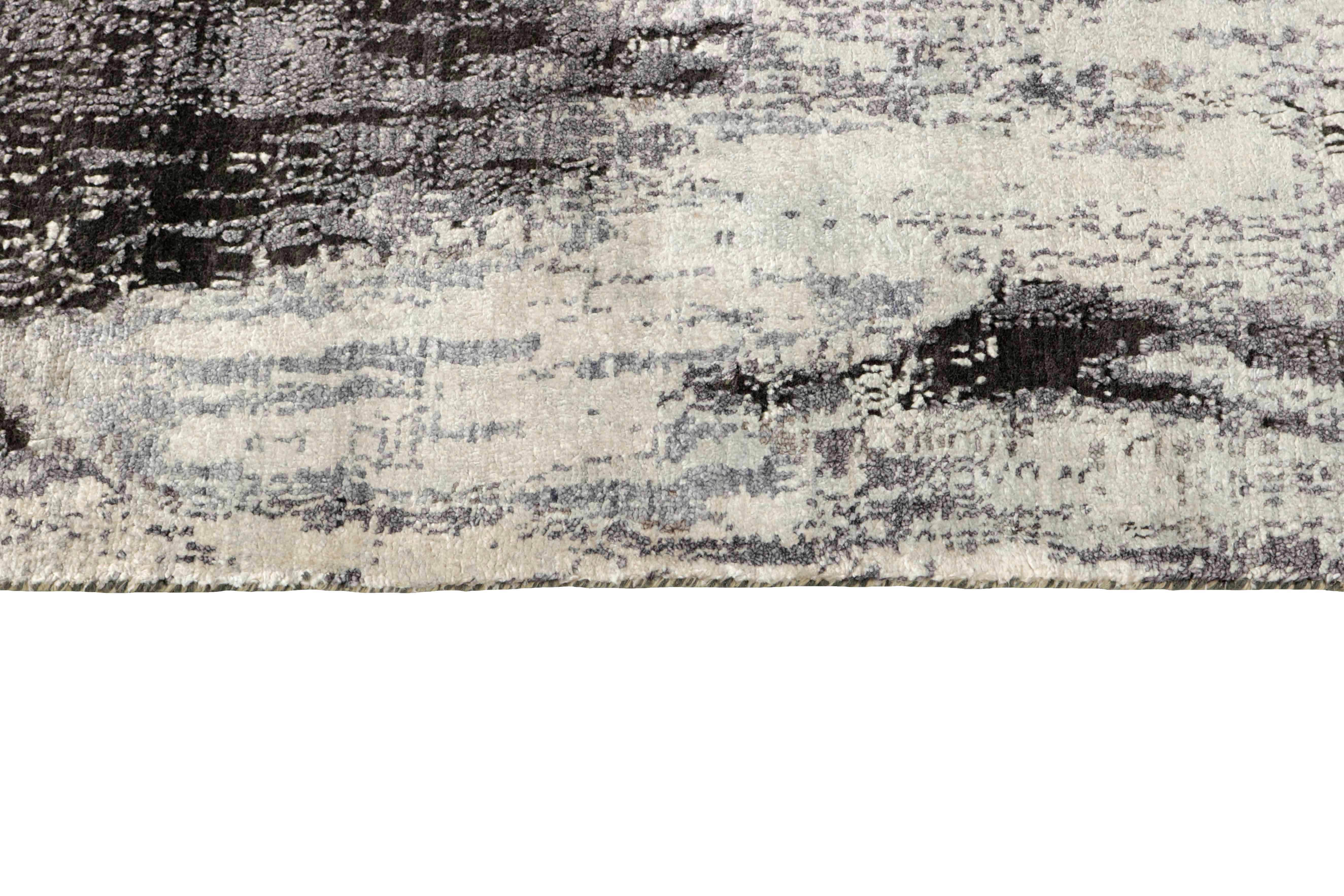 Large area rug with abstract design in charcoal and grey