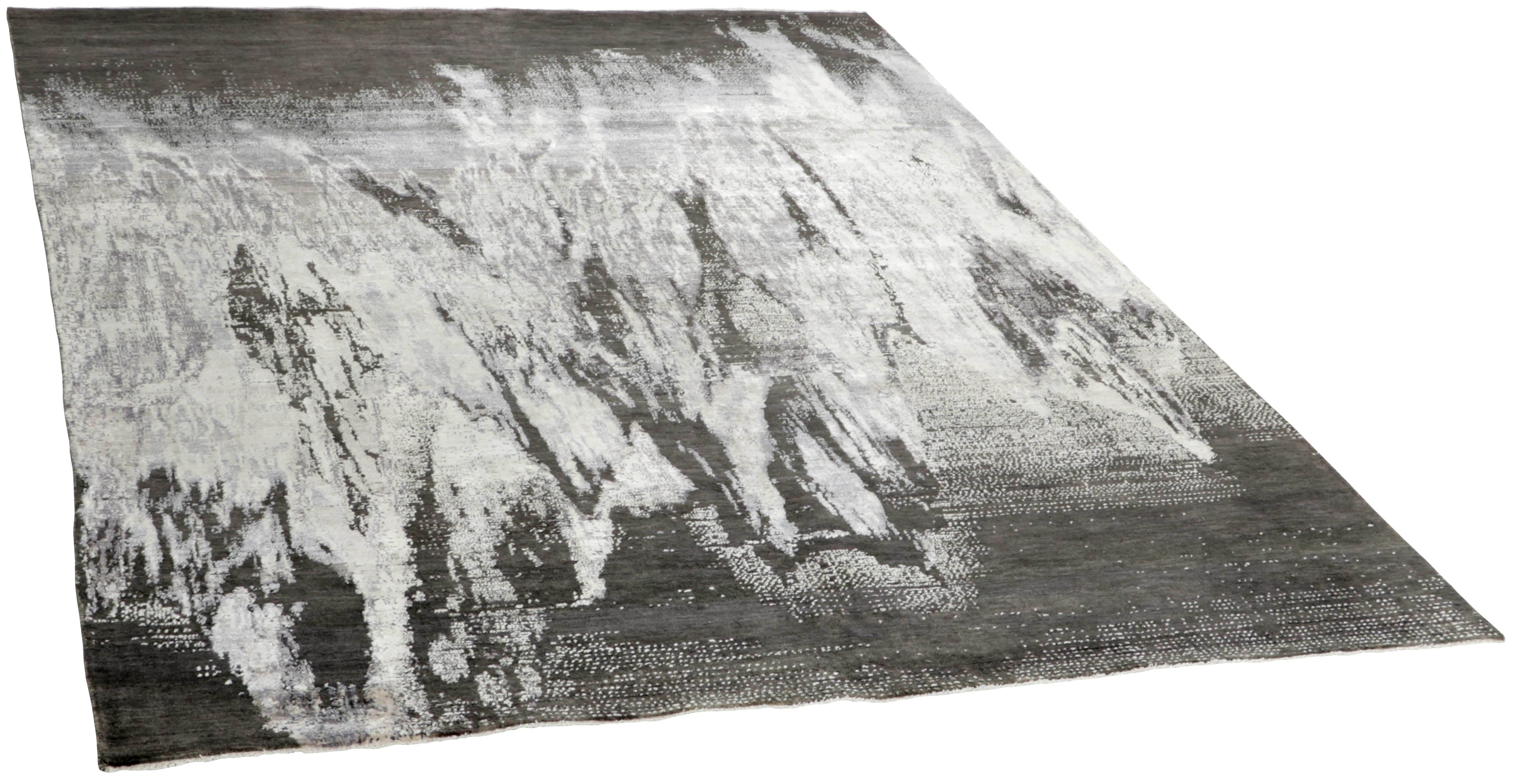 Large area rug with abstract design in charcoal and grey
