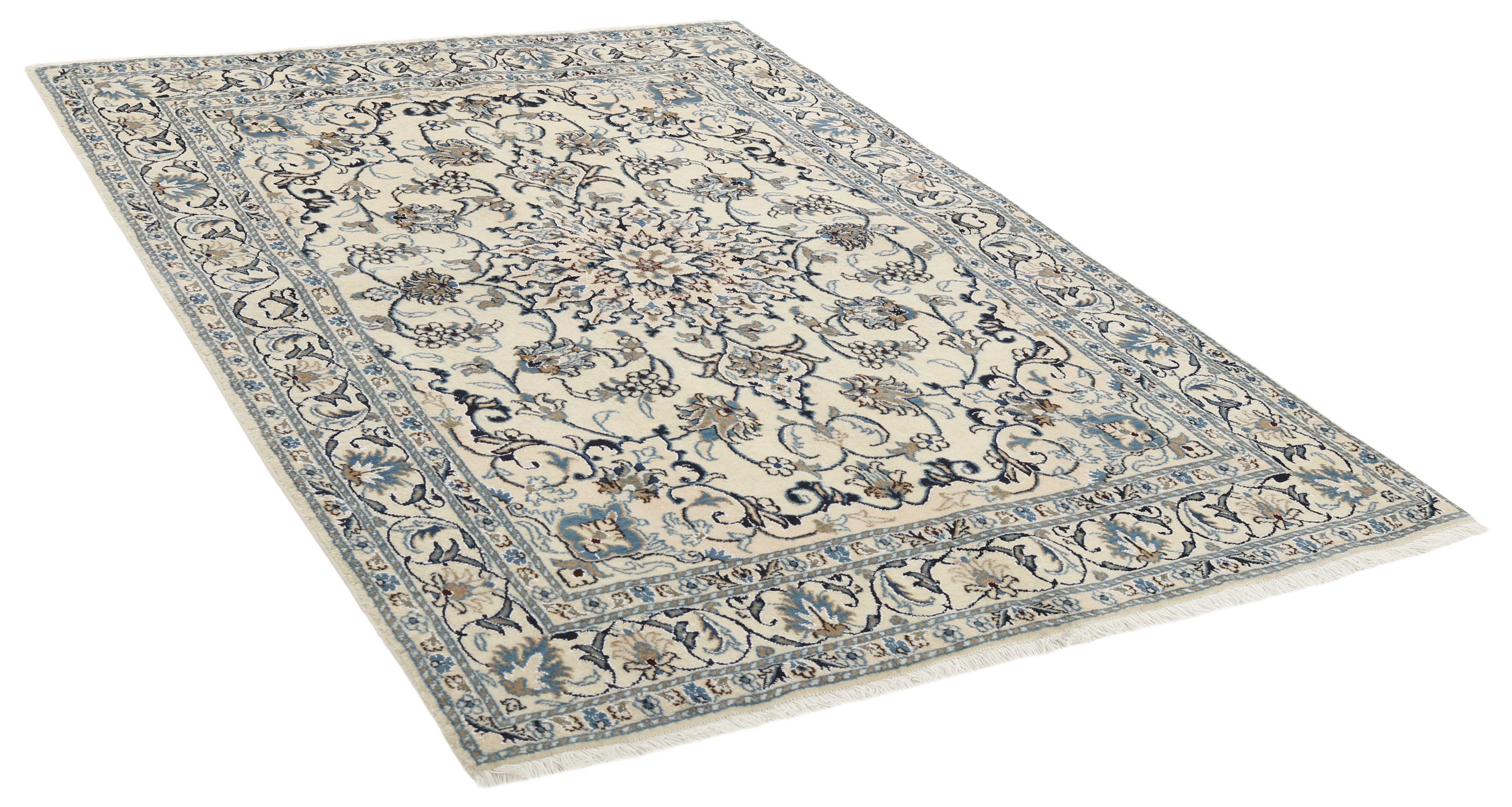 Authentic persian rug with a traditional floral design in cream and blue