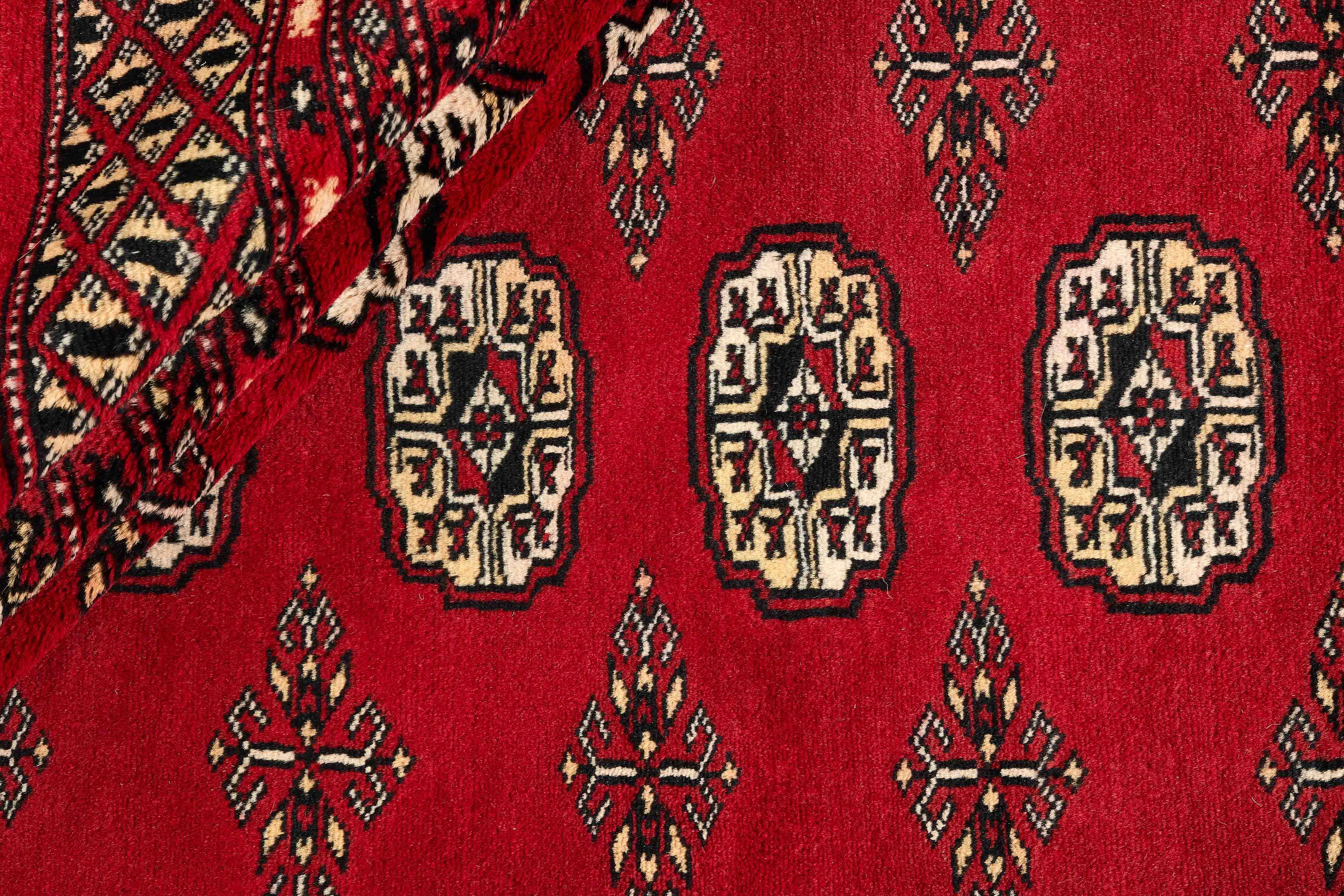 red oriental rug with traditional pattern