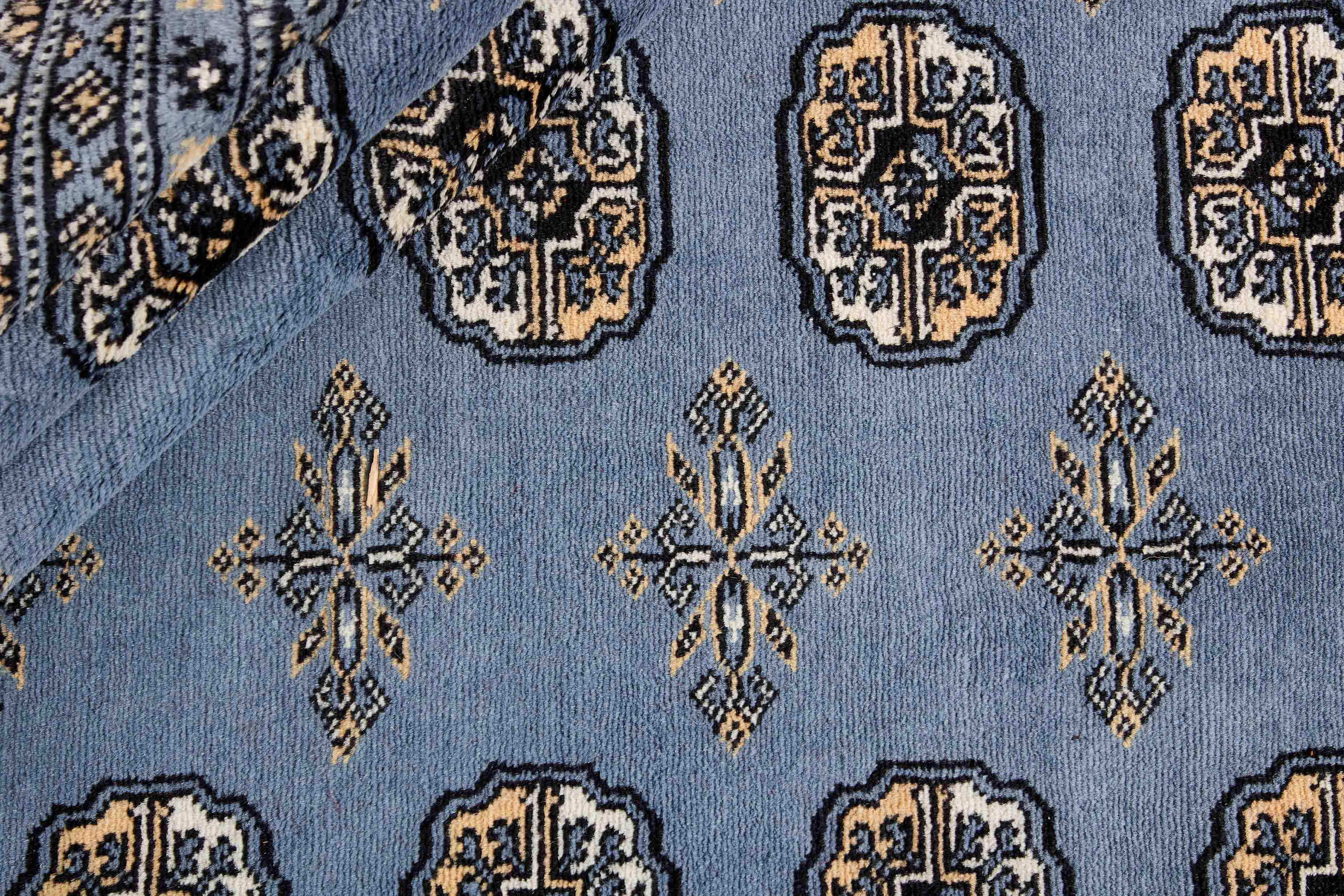 blue oriental rug with traditional pattern