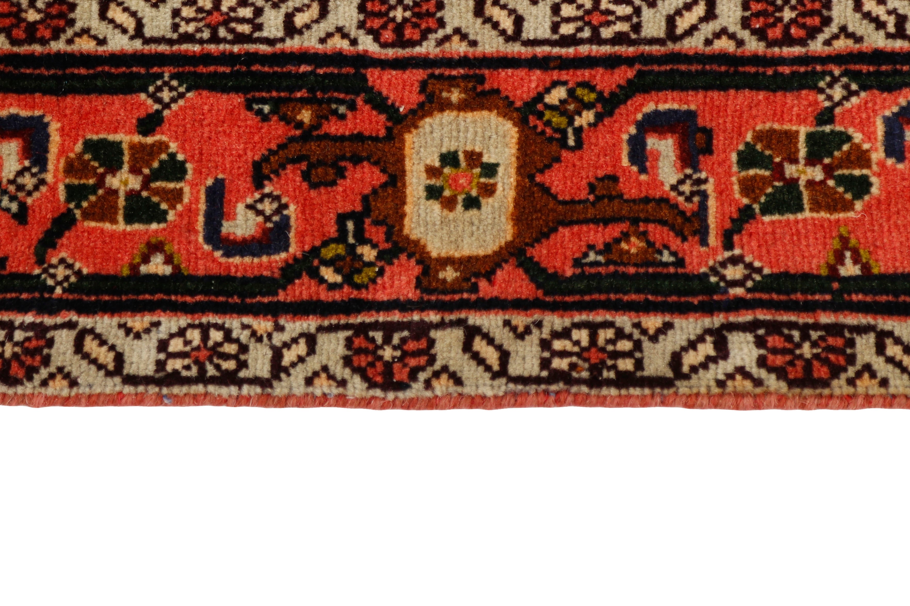 authentic persian rug with a traditional geometric design in red