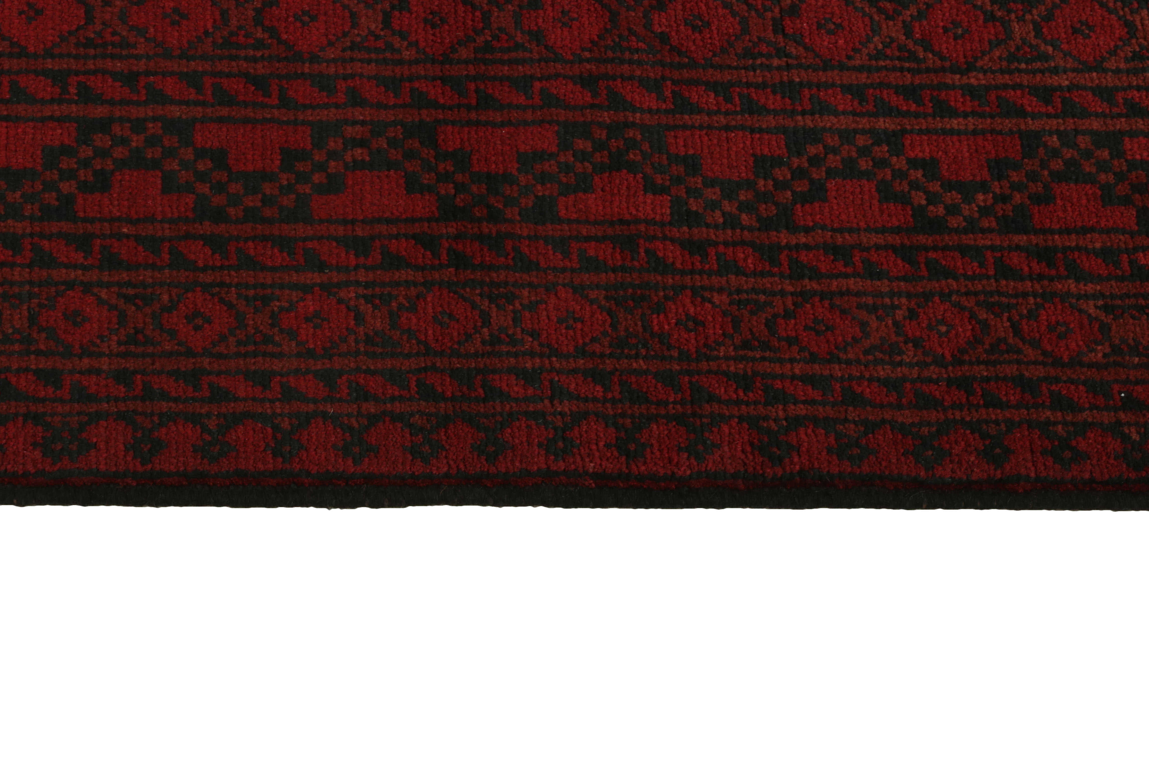 Red oriental rug with traditional elephant's foot pattern