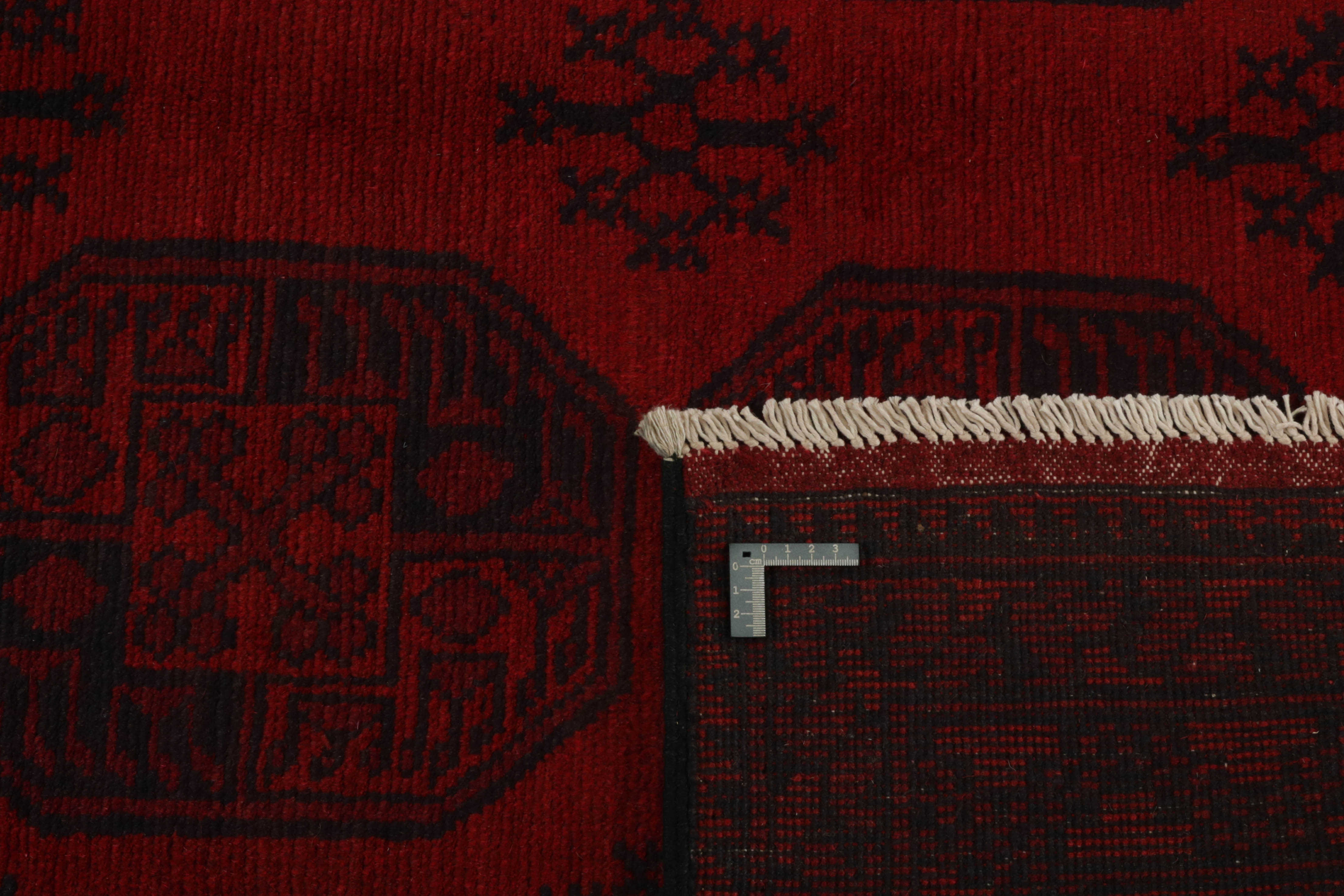 Red oriental rug with traditional elephant's foot pattern