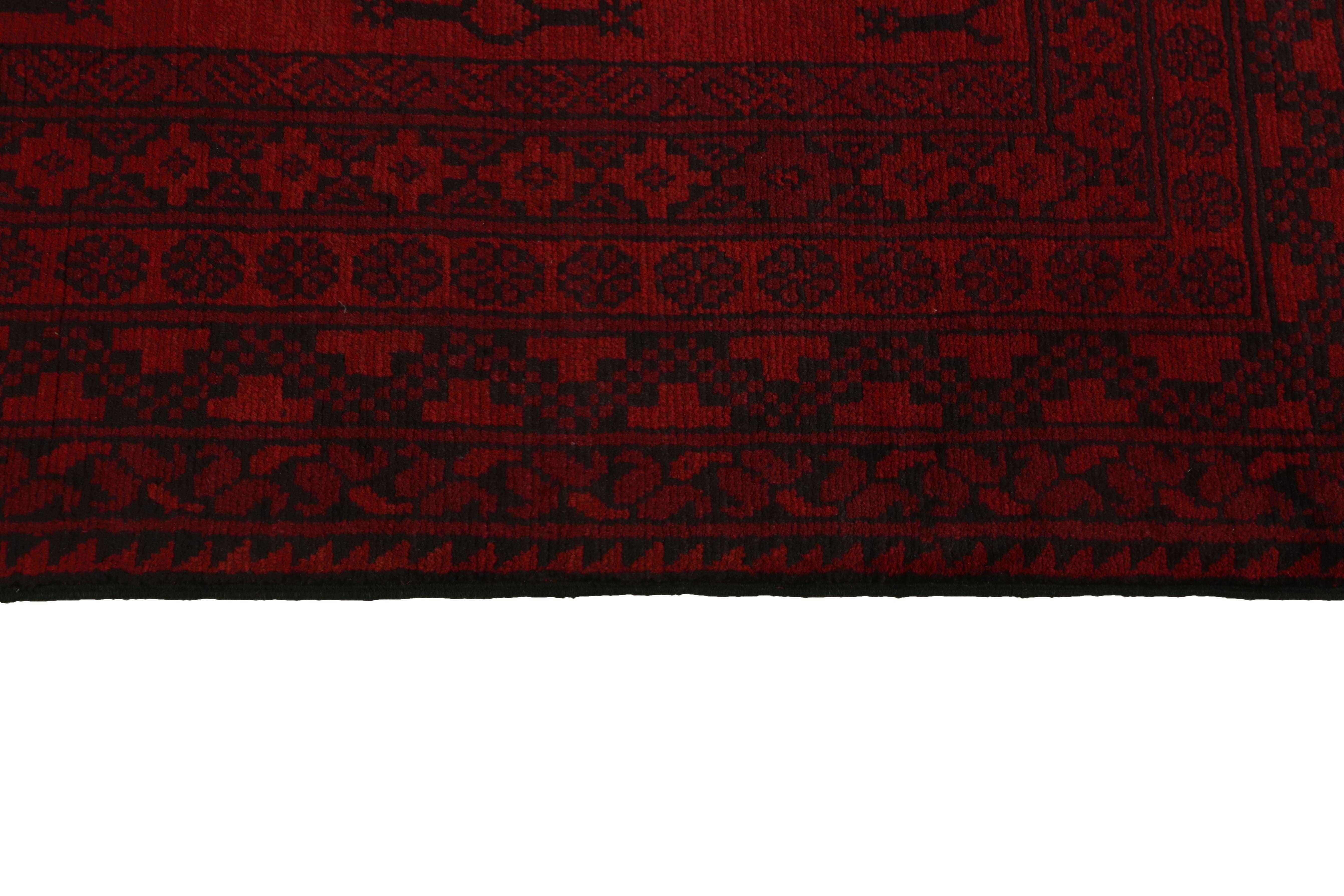 Red oriental rug with traditional elephant's foot pattern