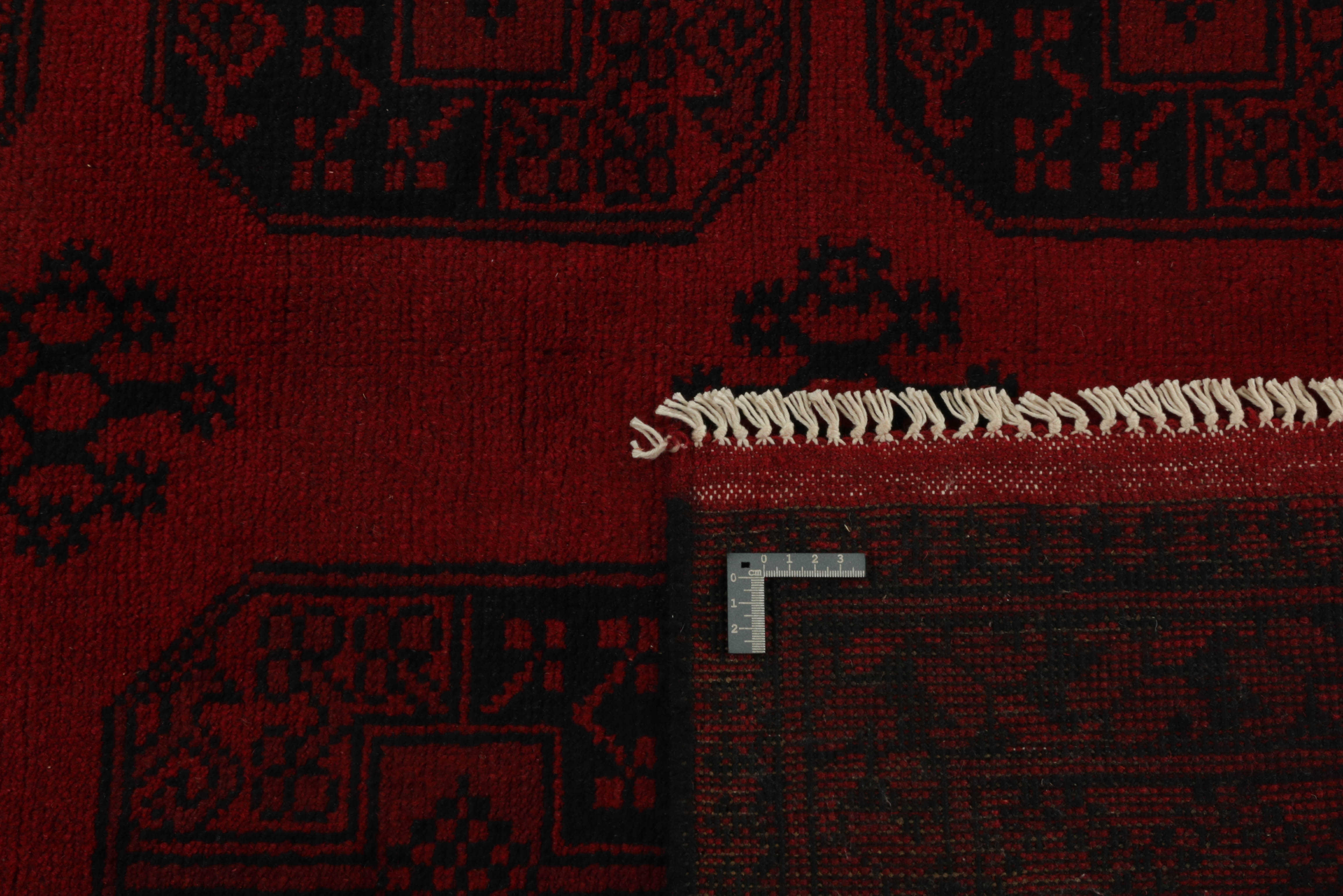 Red oriental rug with traditional elephant's foot pattern