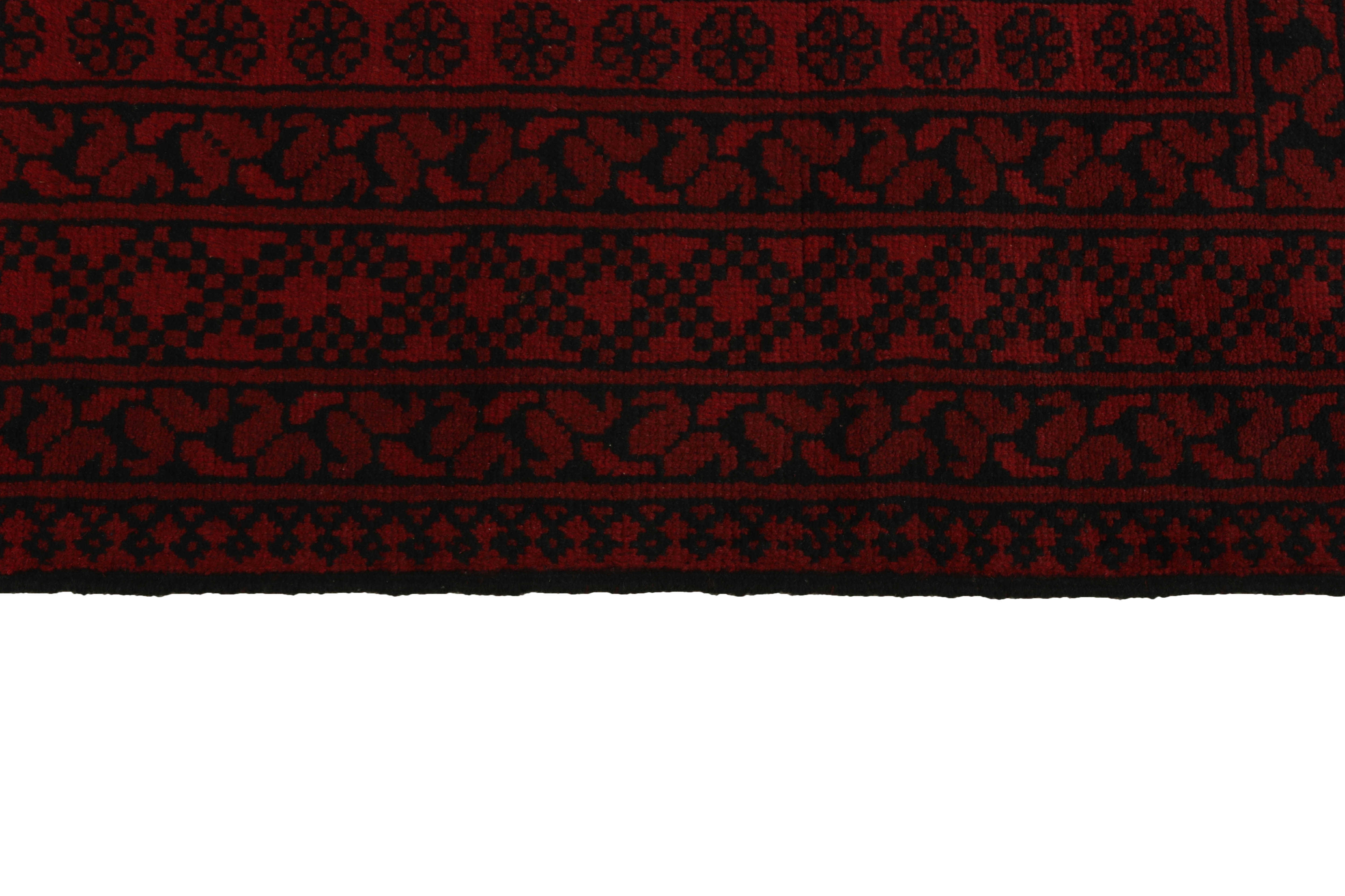 Red oriental rug with traditional elephant's foot pattern