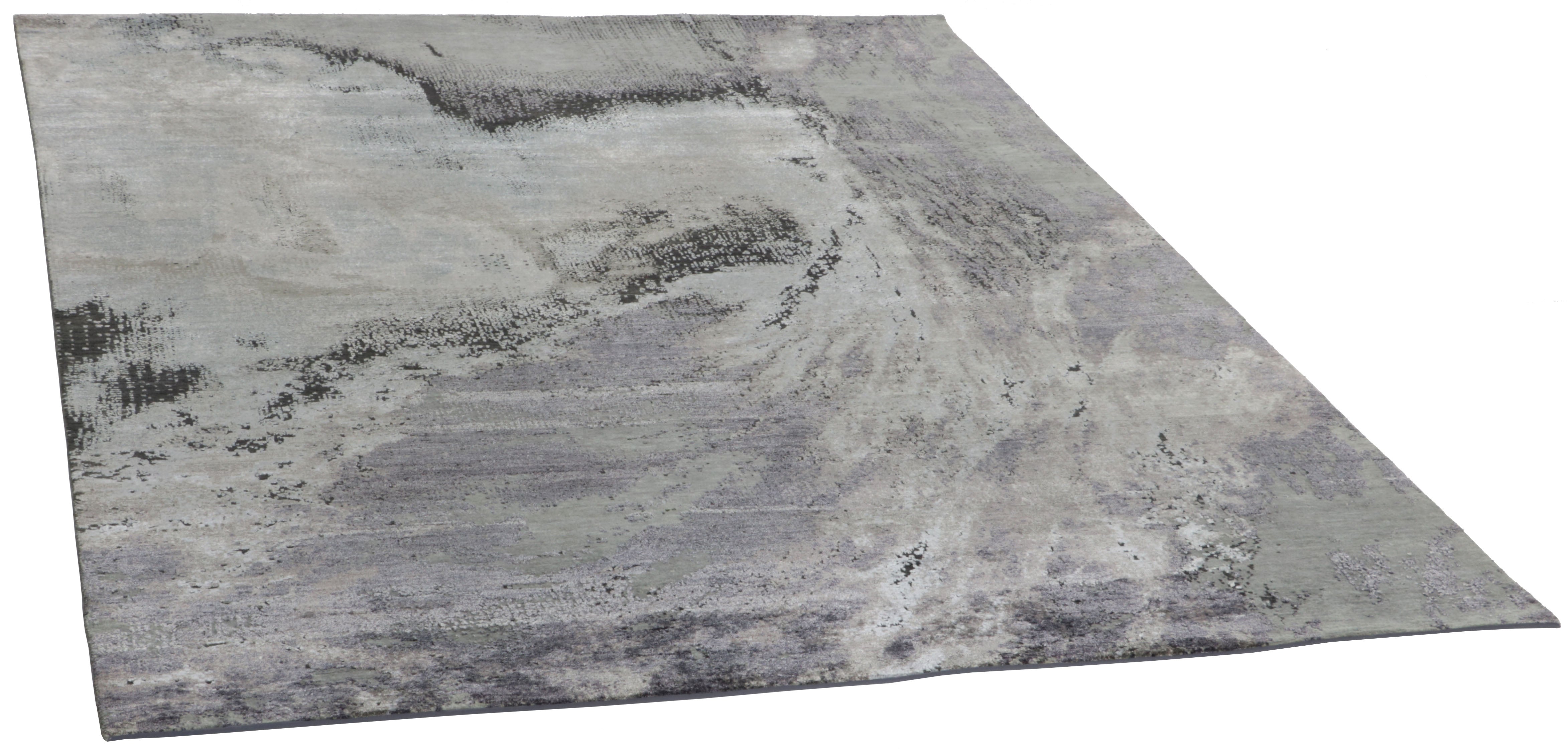 Large area rug with abstract design in grey and taupe