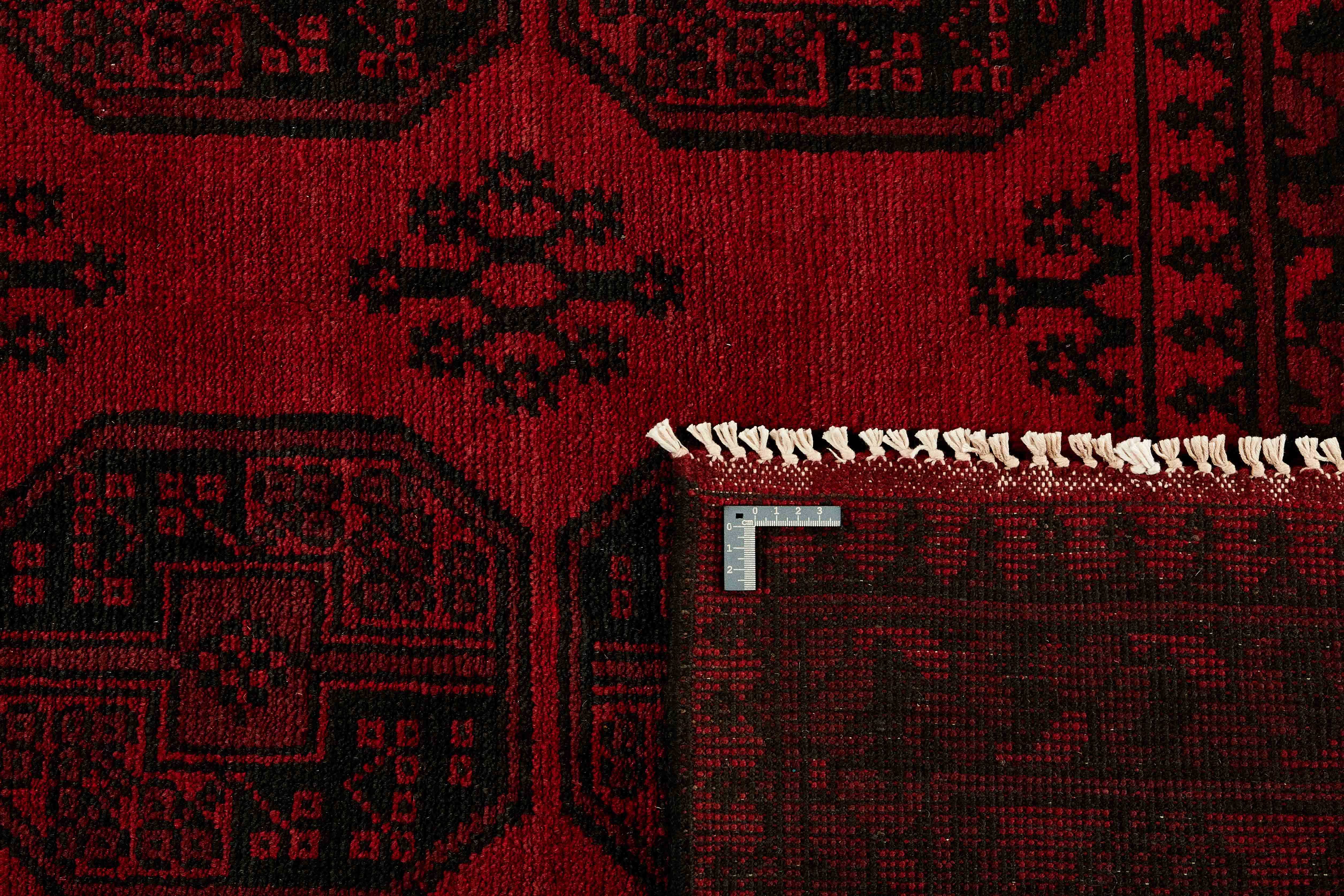 Red oriental rug with traditional 