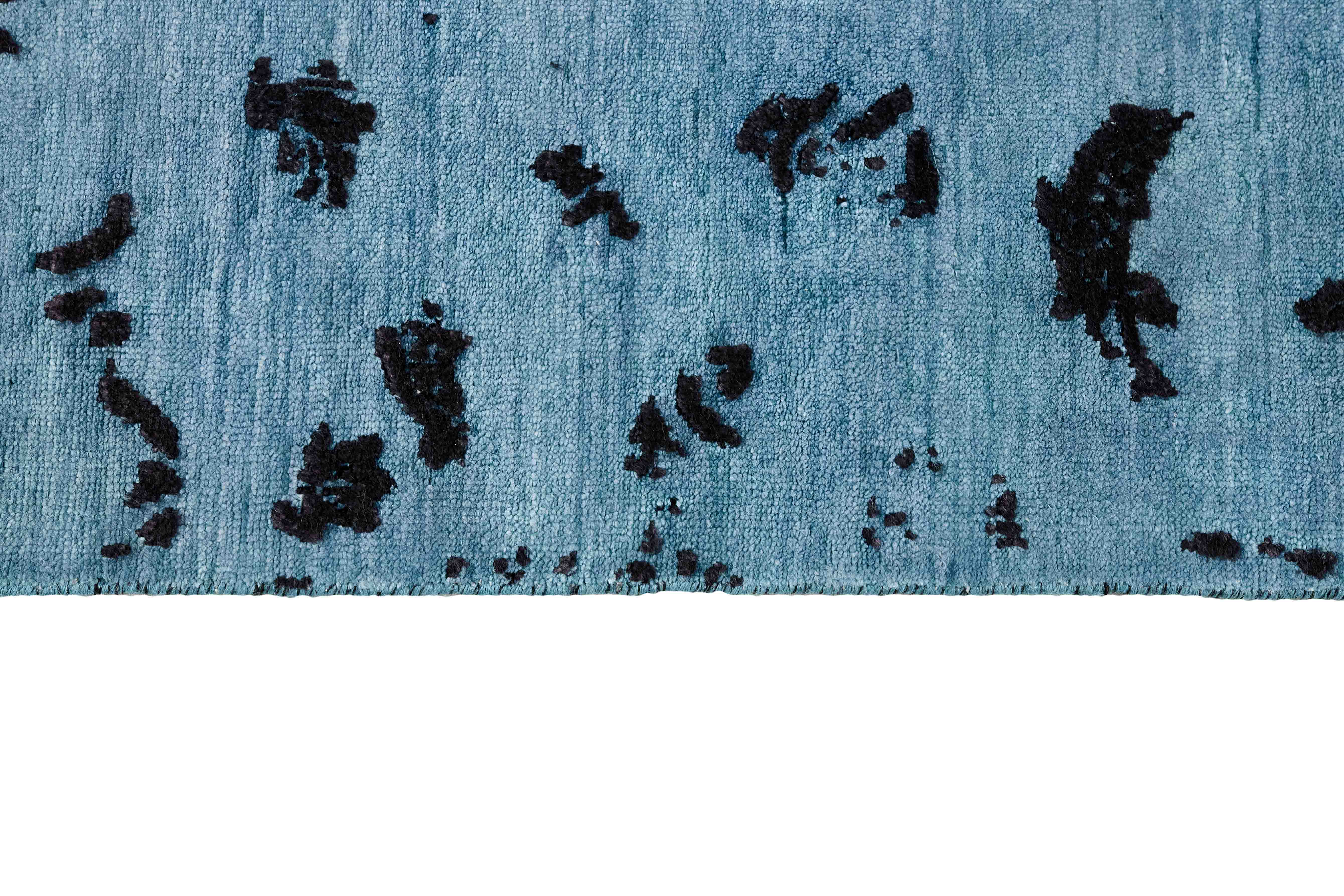 Authentic oriental rug with a damask pattern in blue and black