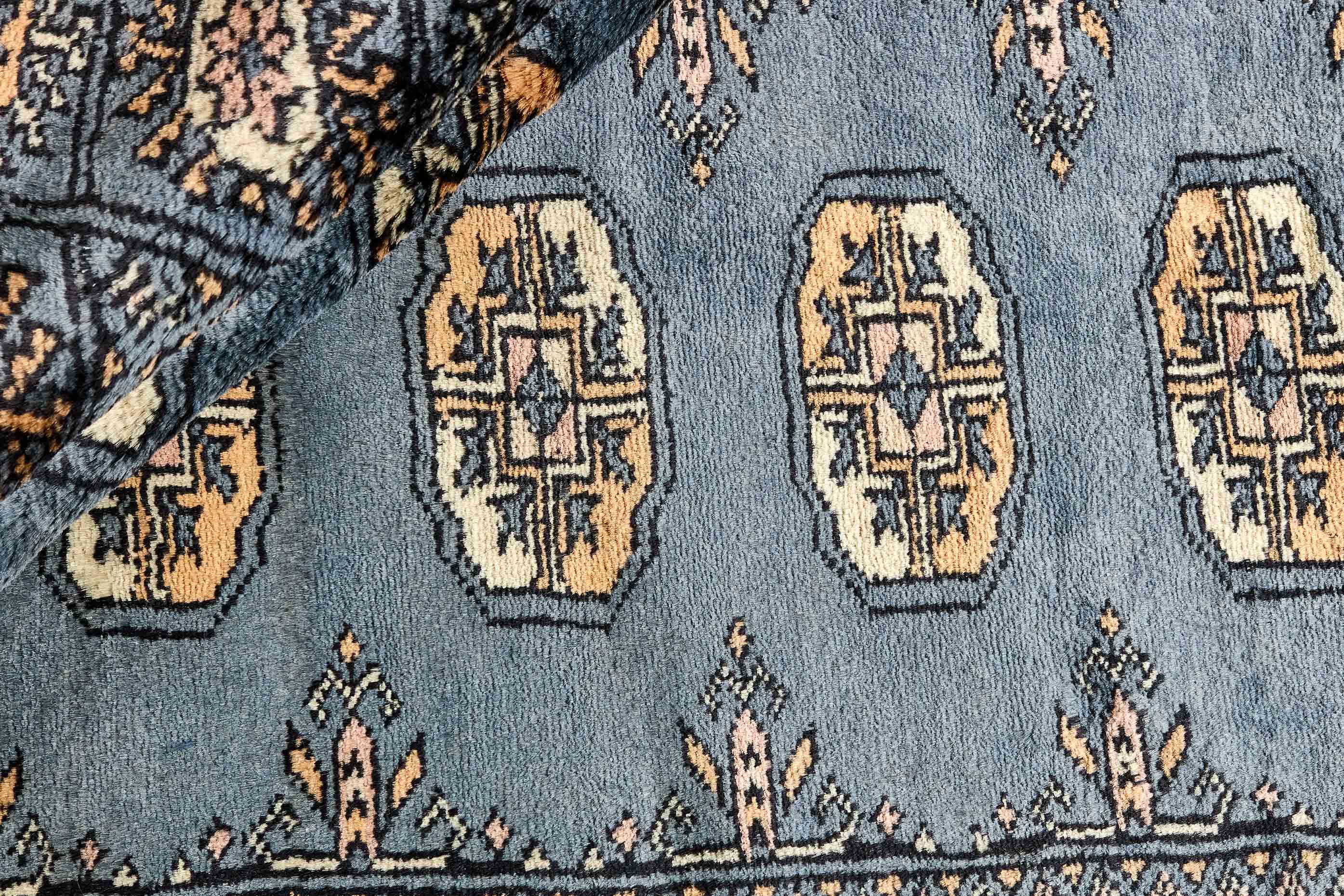 blue oriental rug with traditional pattern