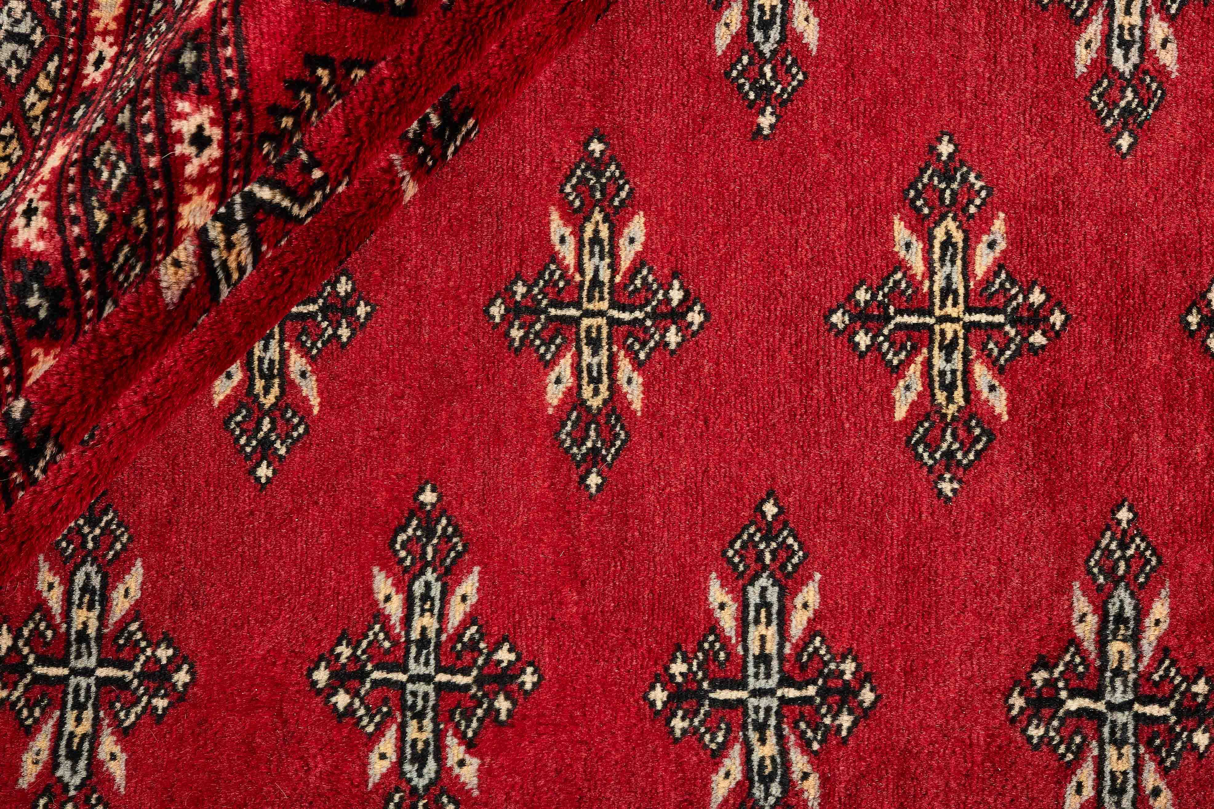 red oriental rug with traditional pattern