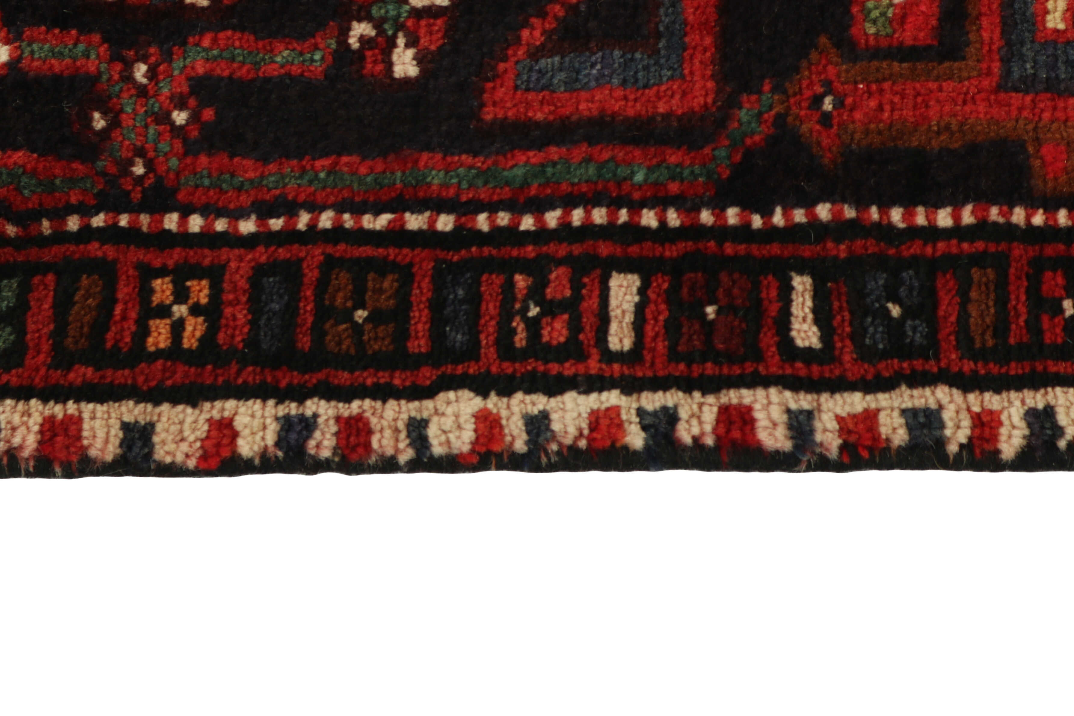 Authentic persian rug with traditional geometric tribal design in red