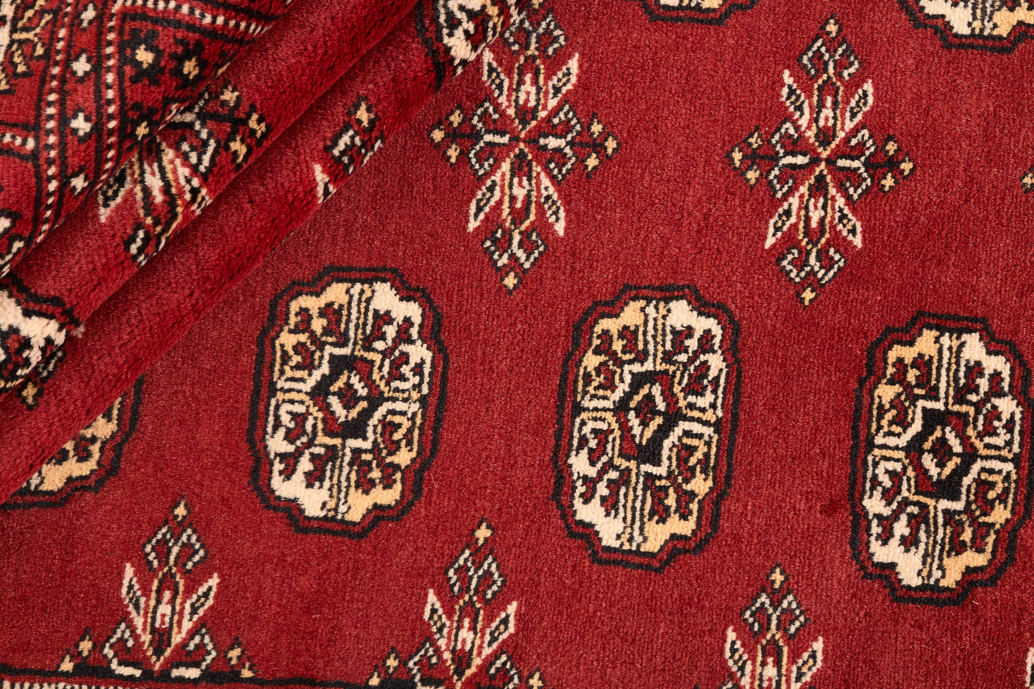 red oriental rug with traditional pattern