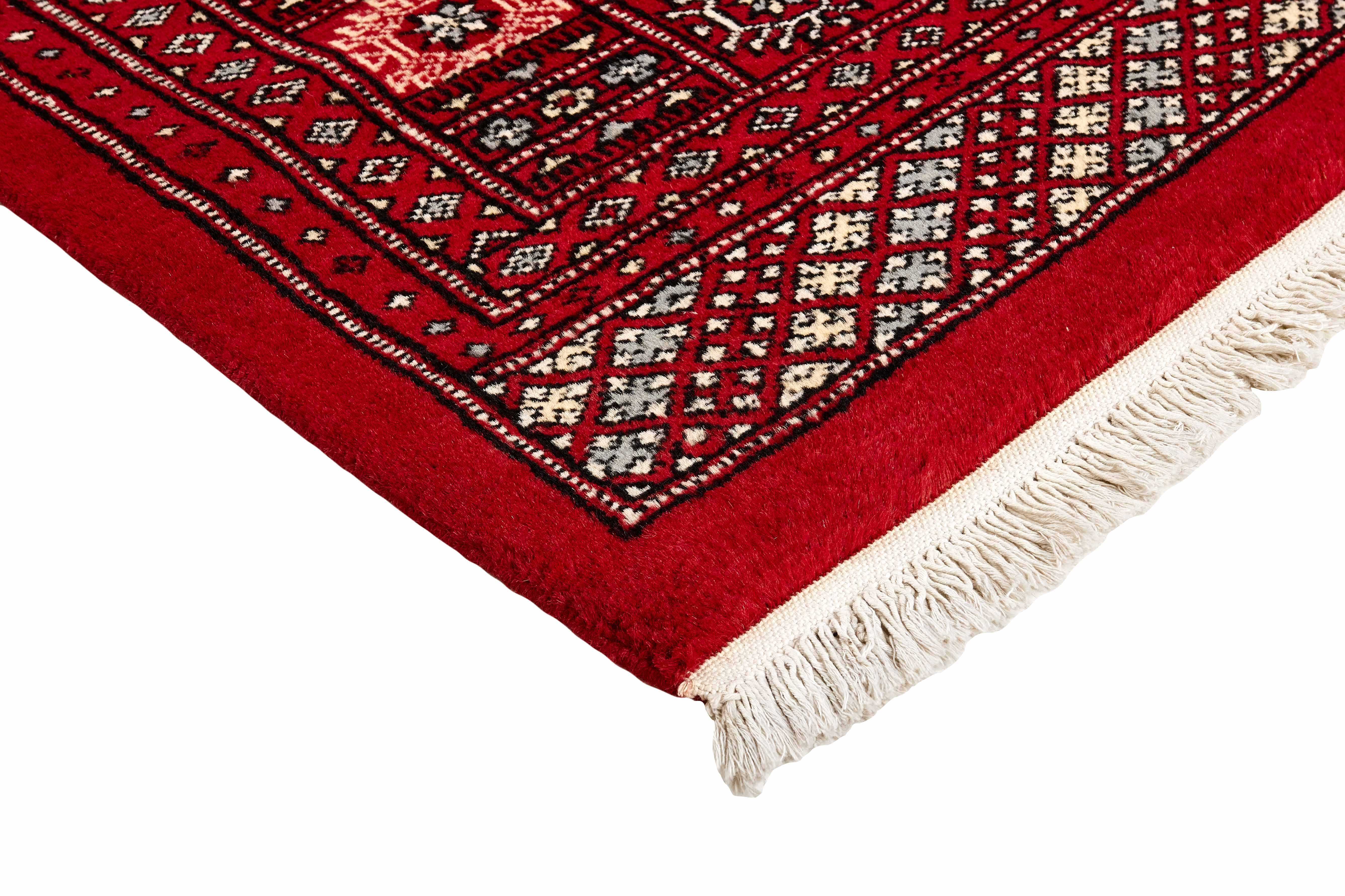 red oriental rug with traditional pattern