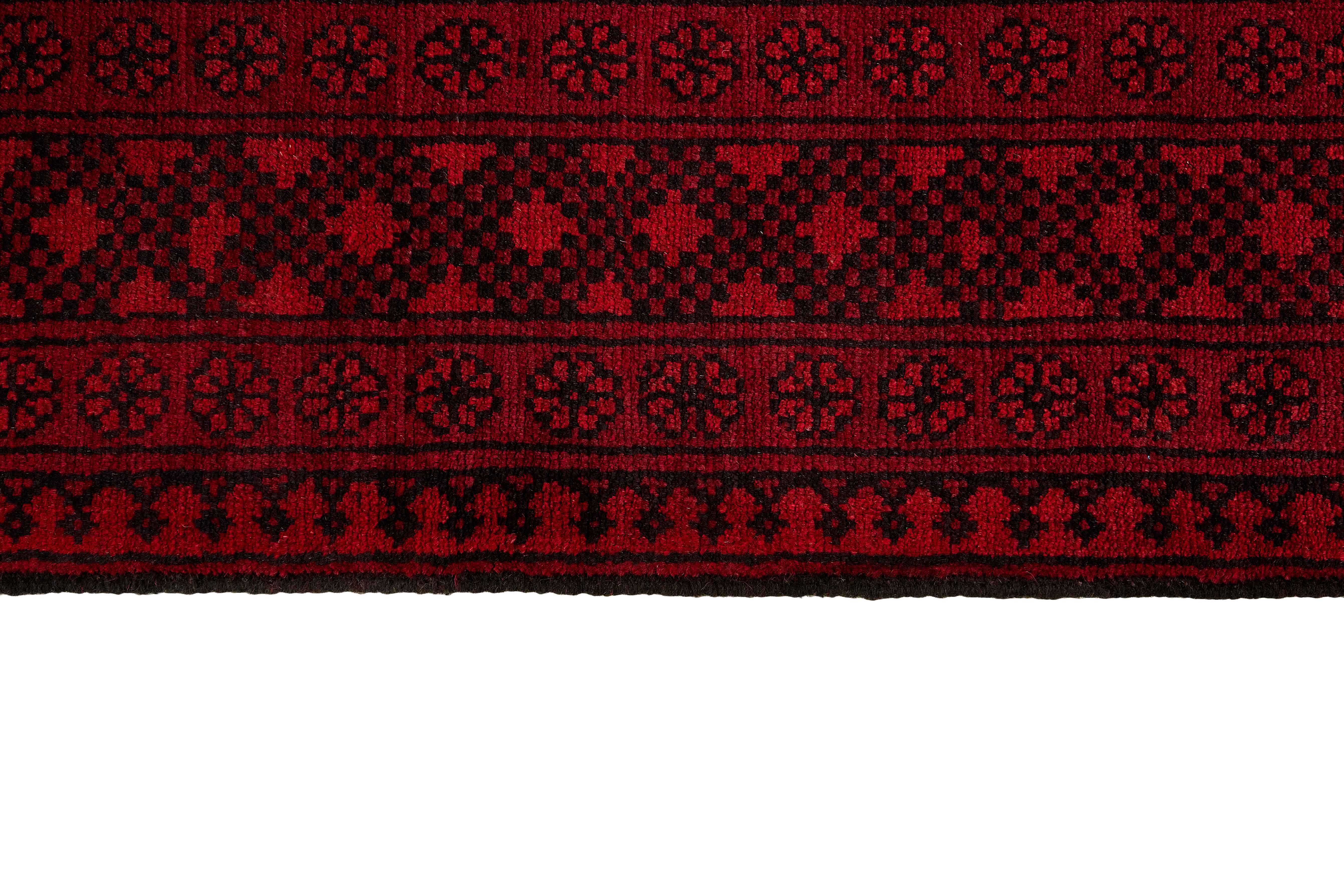 Red oriental rug with traditional elephant's foot pattern