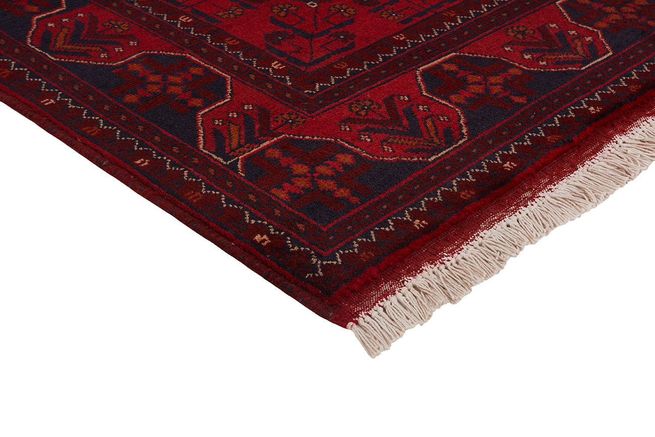 Authentic Oriental rug with traditional geometric tribal design in red
