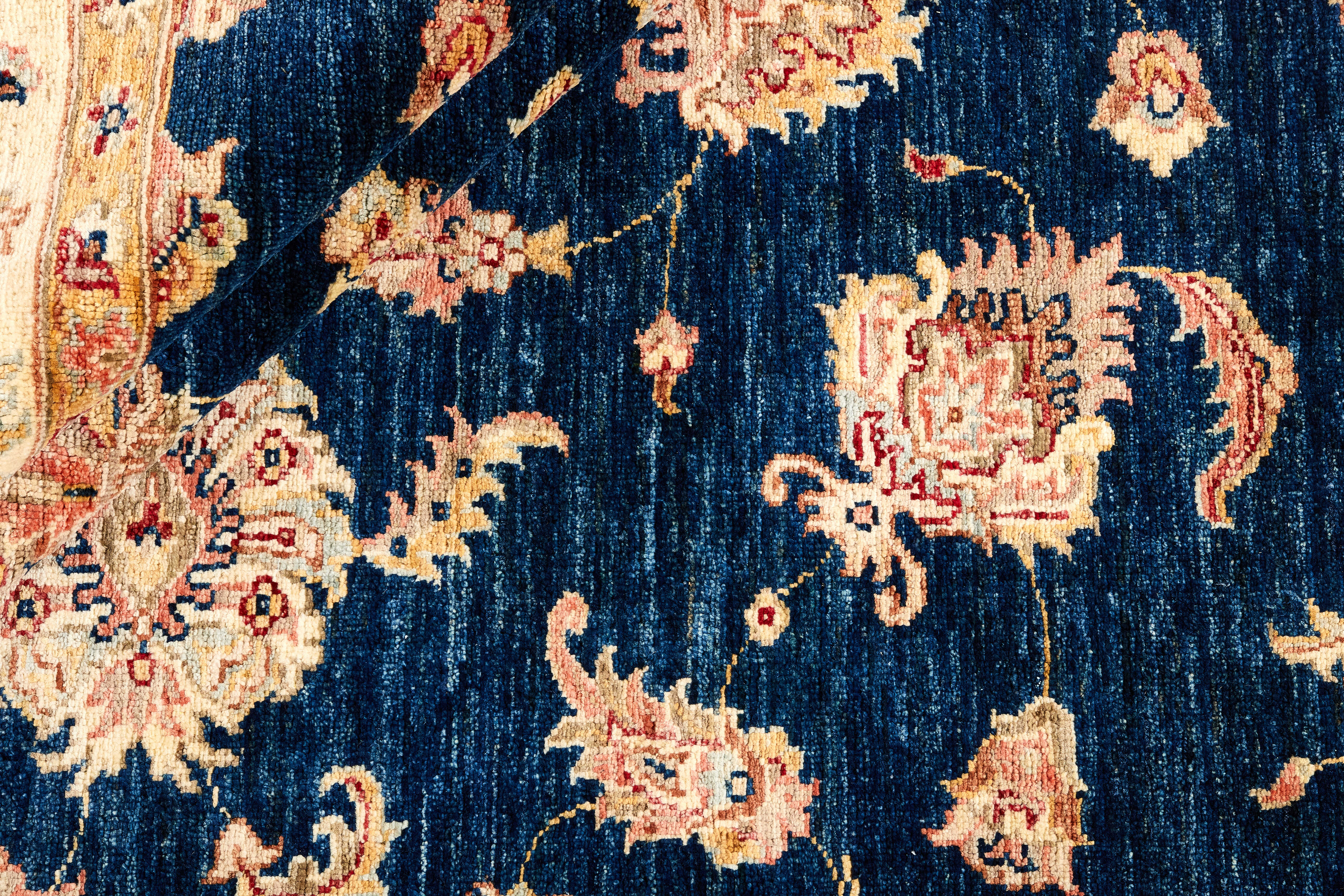 square oriental rug with blue and beige floral pattern