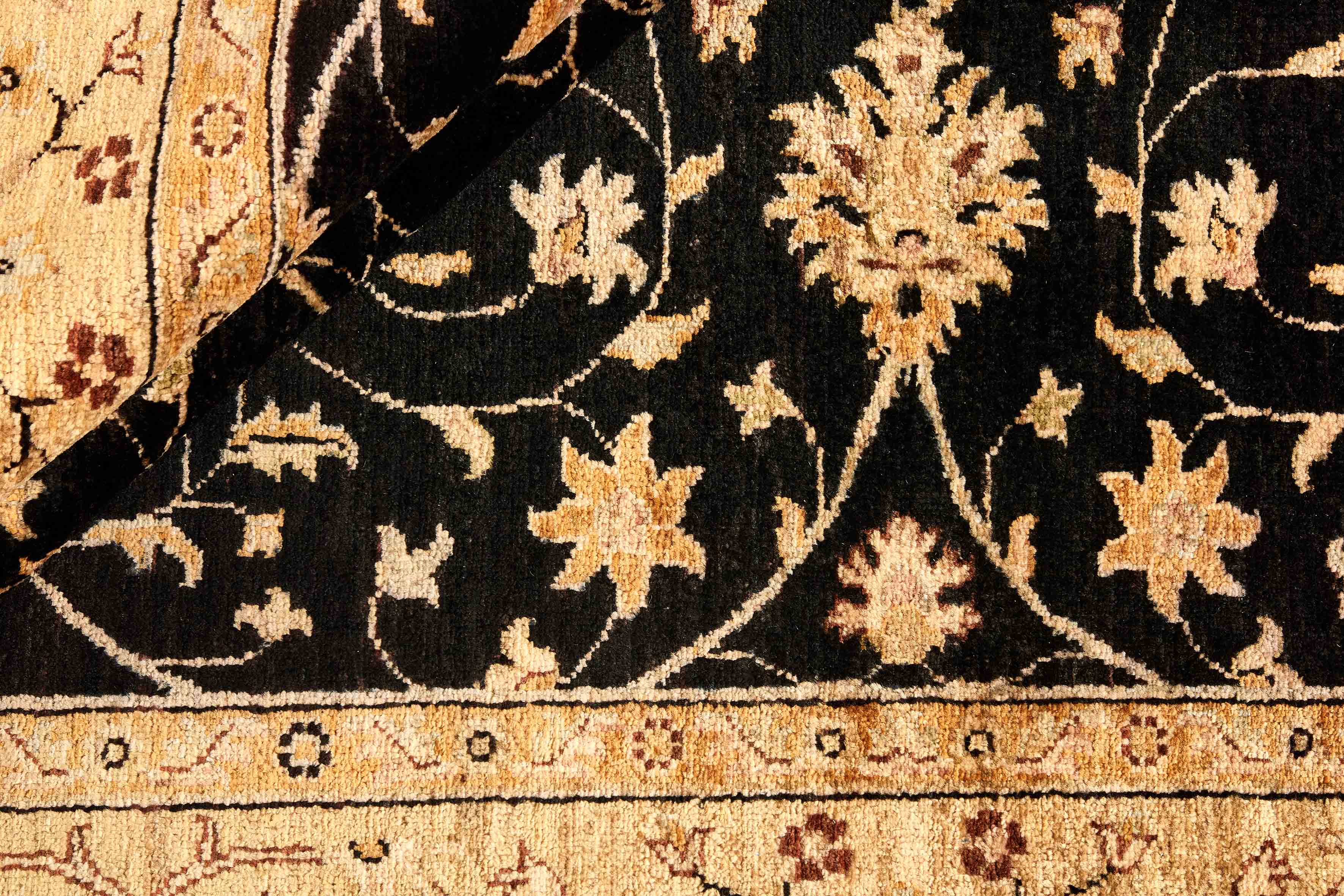 oriental rug with beige and black floral pattern