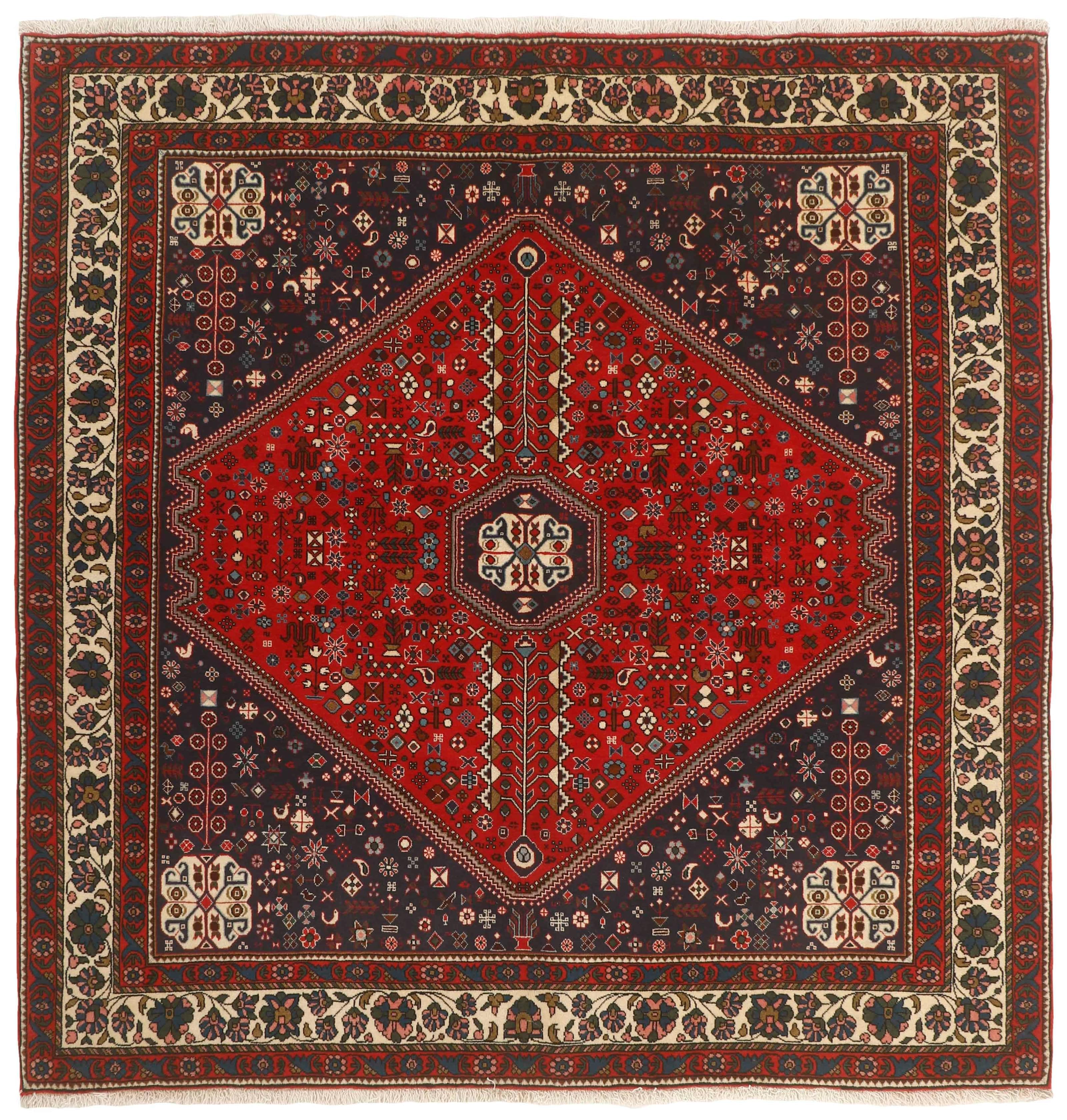 Authentic persian square rug with traditional tribal geometric design in red, ivory, black and brown