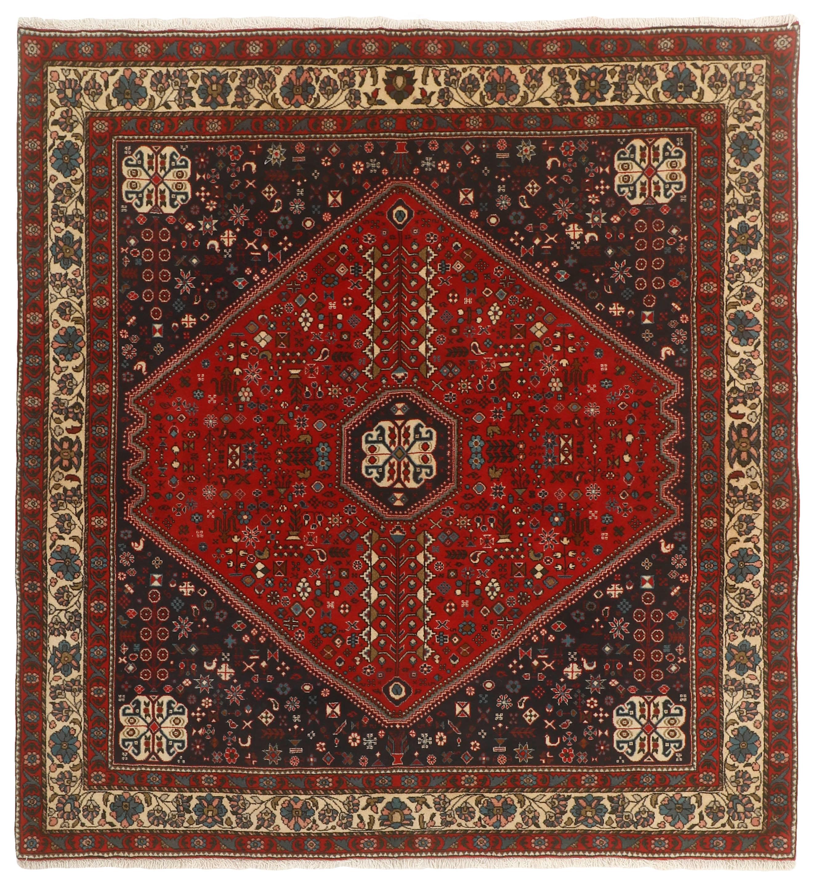 Authentic persian square rug with traditional tribal geometric design in red, ivory, black and brown