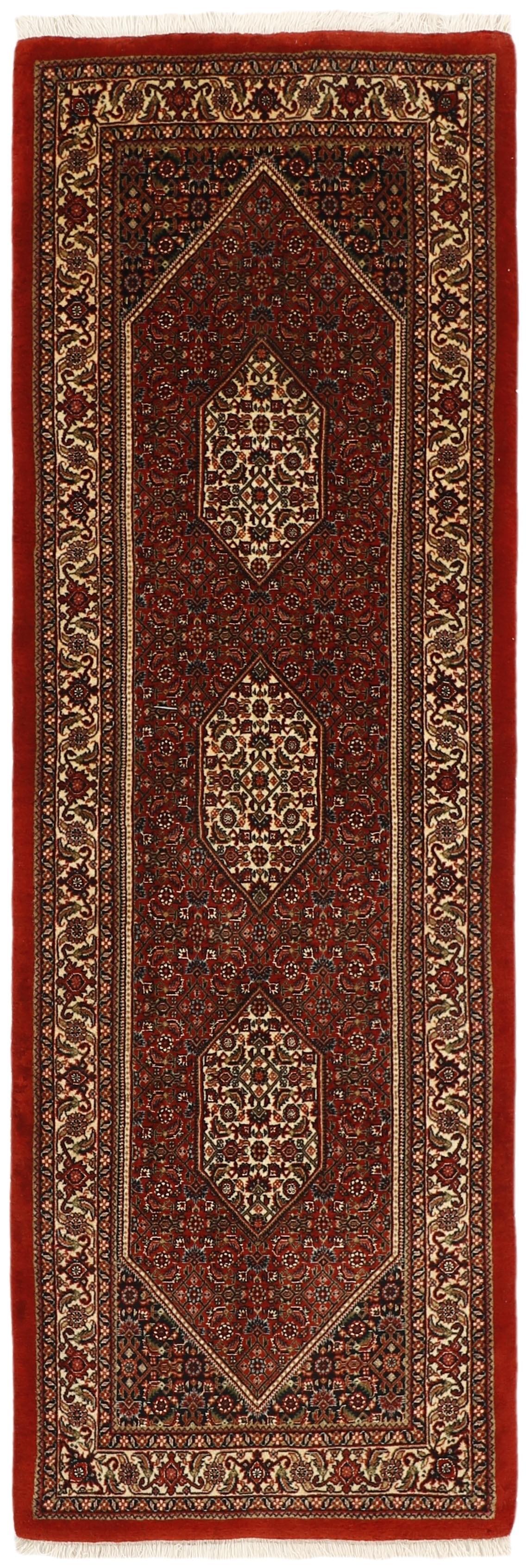 Red and cream persian runner with traditional floral design