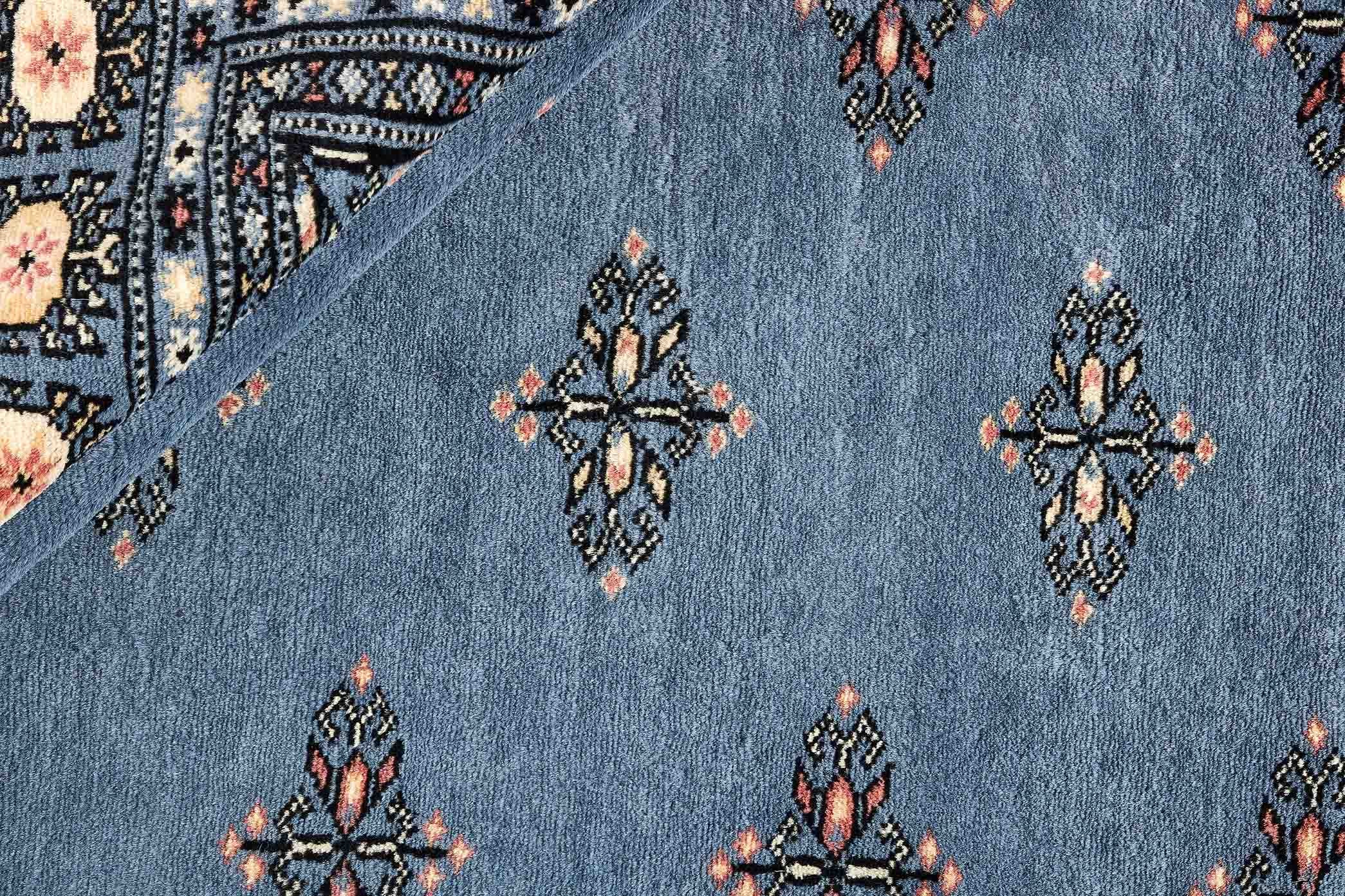 blue oriental rug with traditional pattern